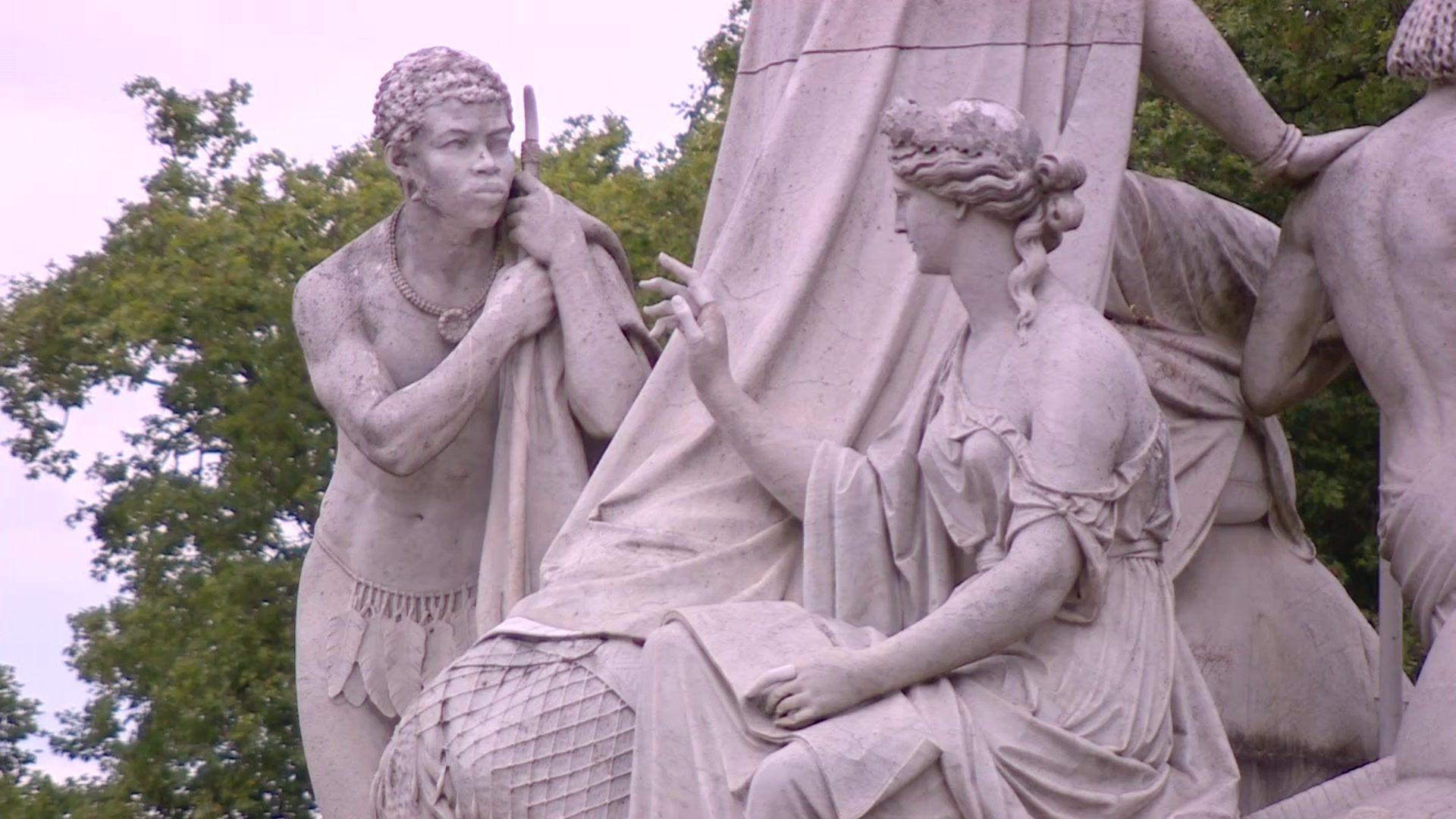 Part of the Albert Memorial which depicts a European woman reading to an African tribesman