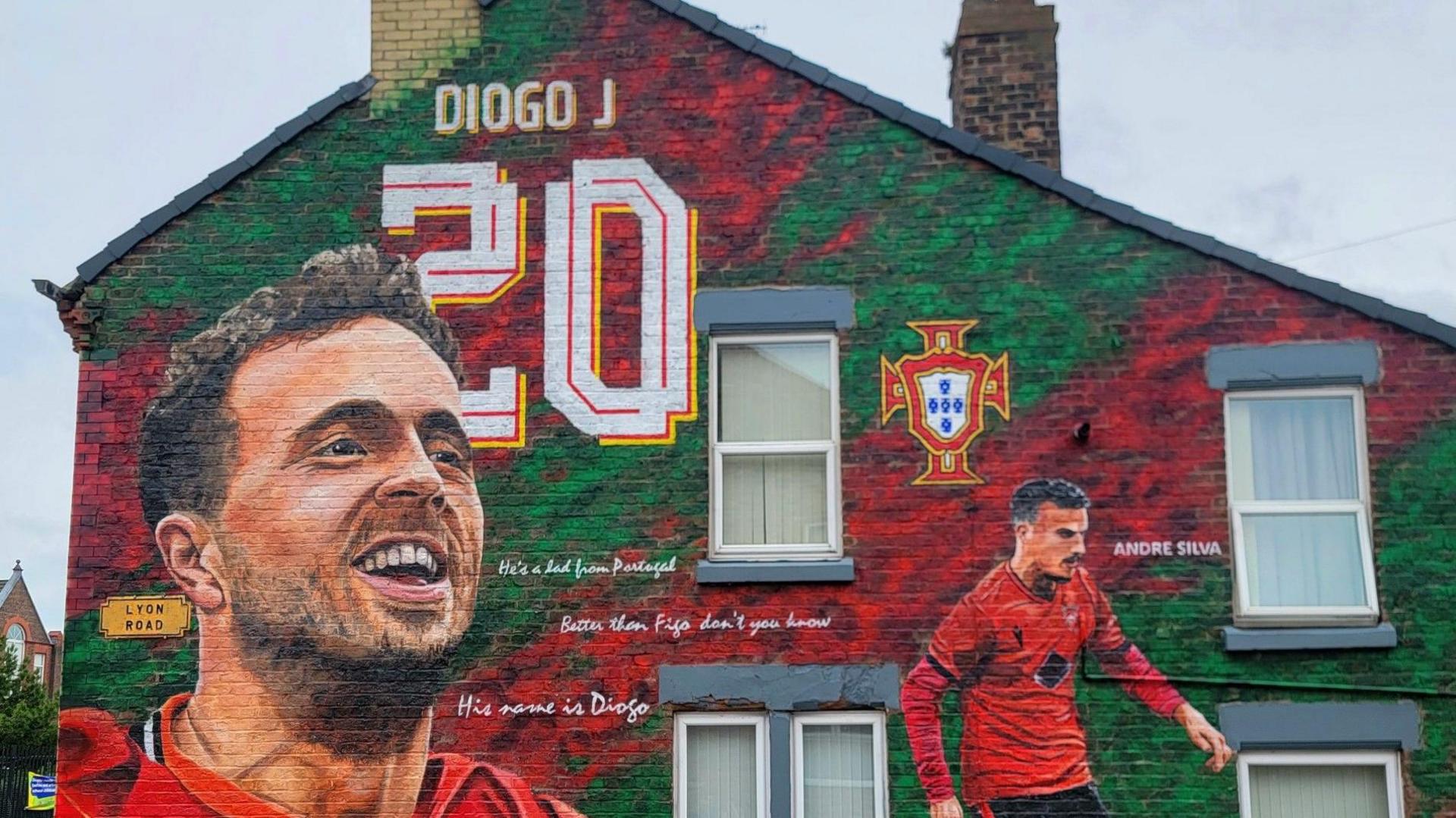 Murals dedicated to Liverpool forward Diogo Jota in his Portuguese kit on the side of a house