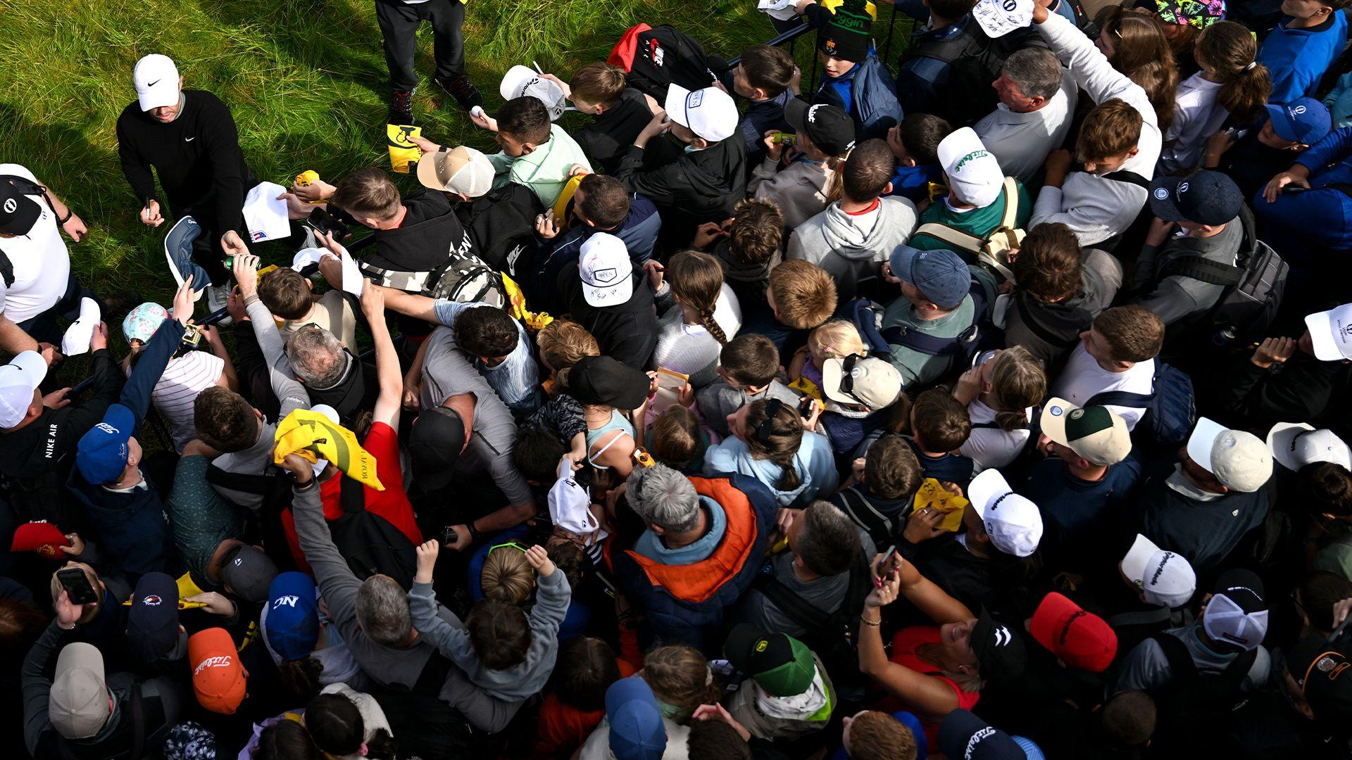 Rory McIlroy signs autographs for young fans