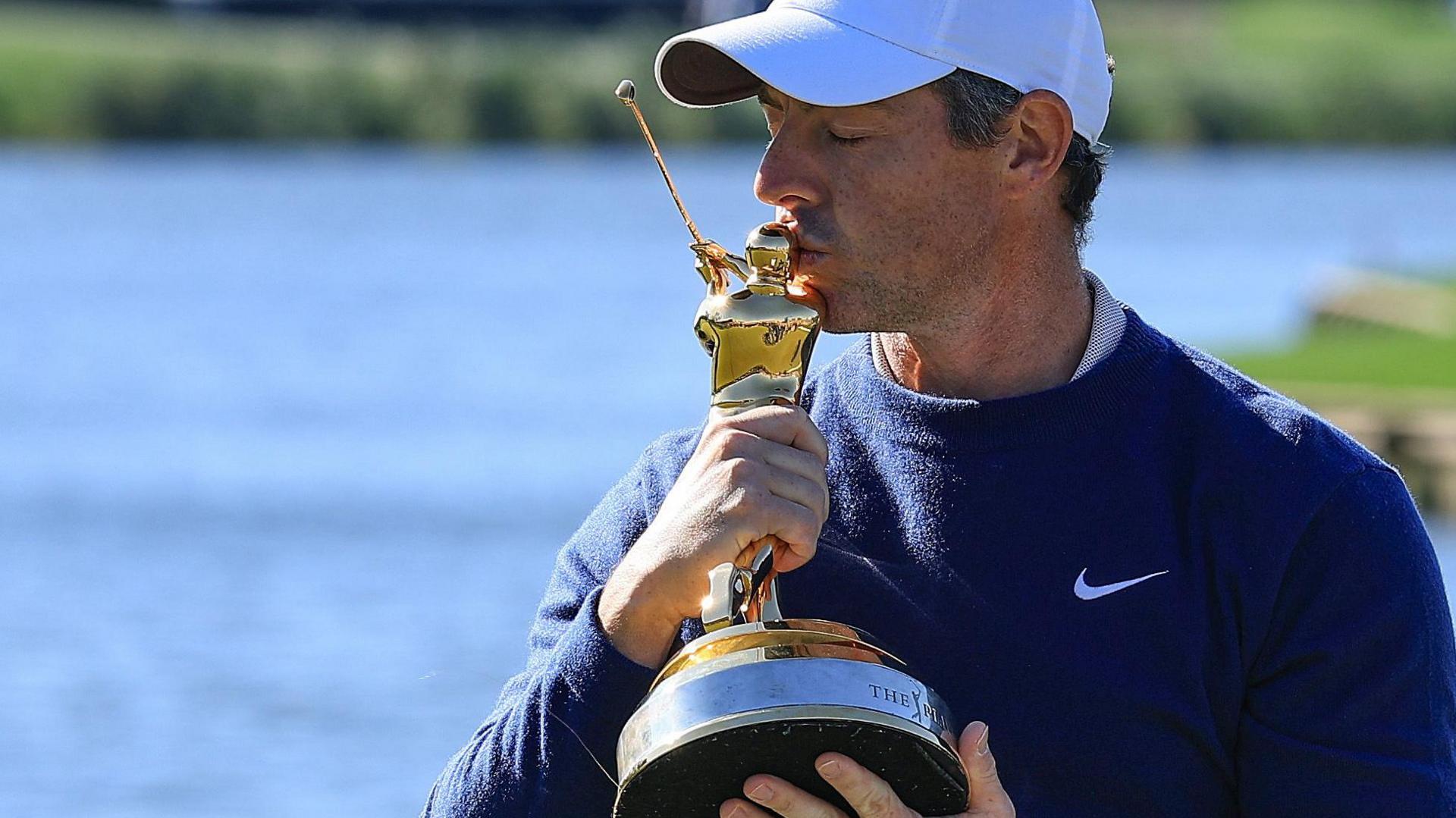 Rory McIlroy kissing the Players Championship trophy