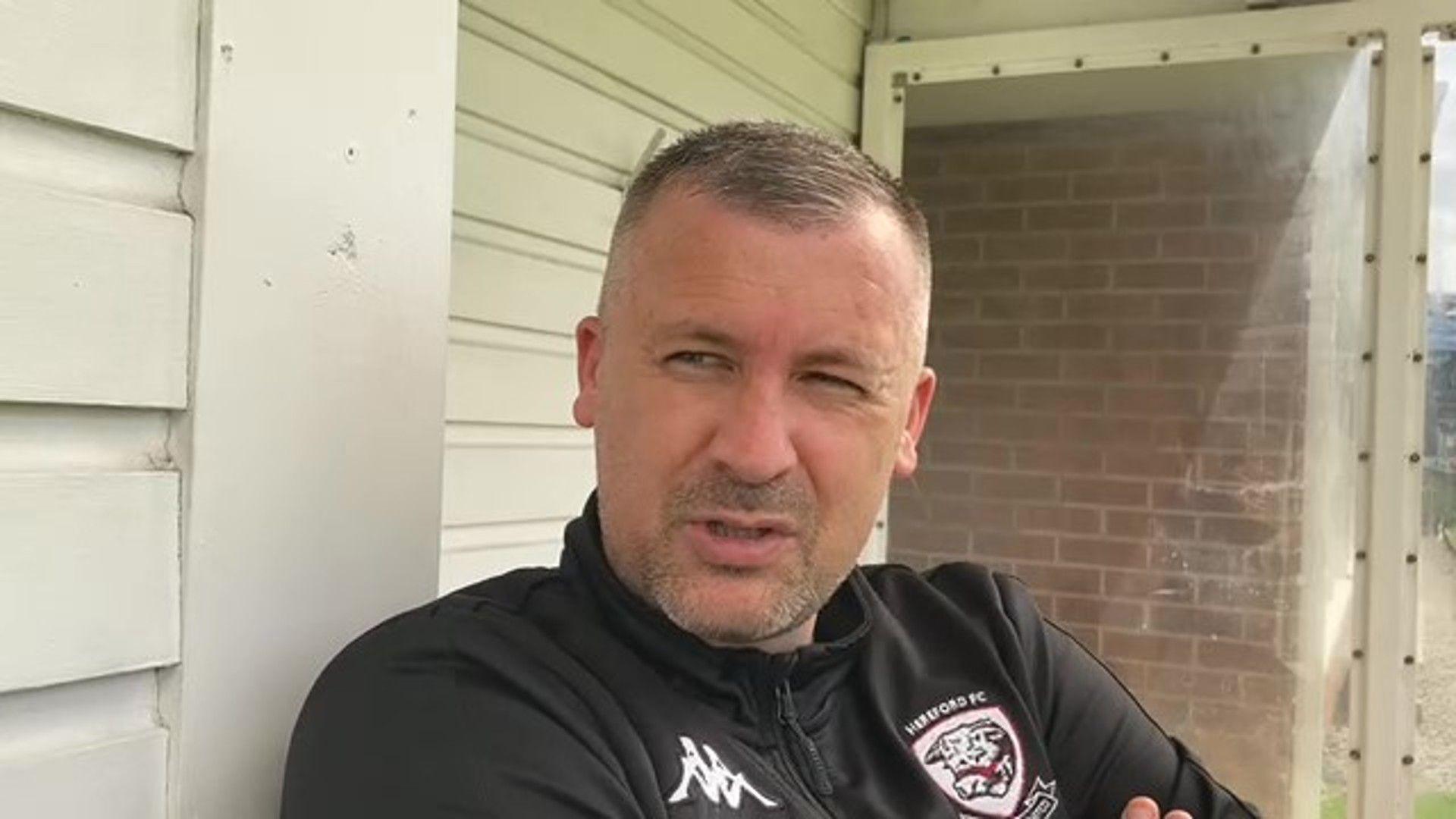 Hereford FC manager Paul Caddis in the dugout at Edgar Street