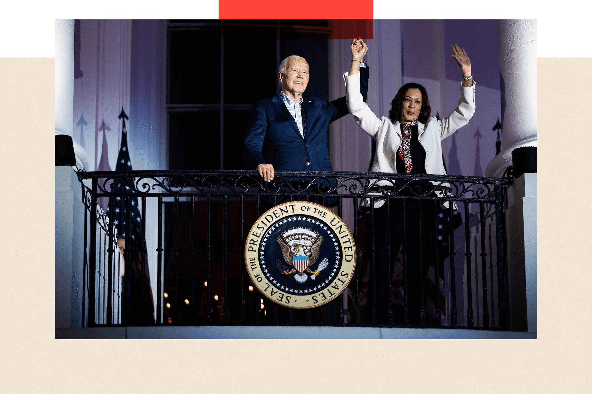 Kamala Harris and Joe Biden on the White House balcony during 4th July celebrations. She is wearing a white jacket and him an open necked shirt and blue suit. Both her hands are raised and President Biden is holding one of them