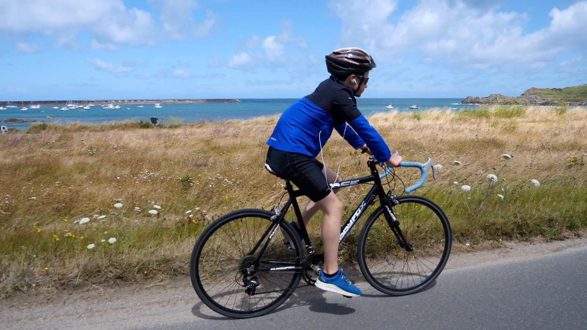 George cycling in Alderney 