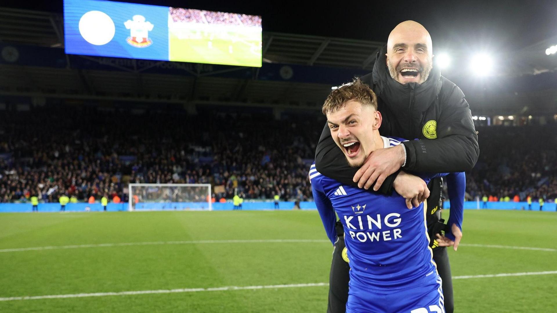 Leicester City Manager Enzo Maresca jumps on the back of  Kiernan Dewsbury-Hall in celebration