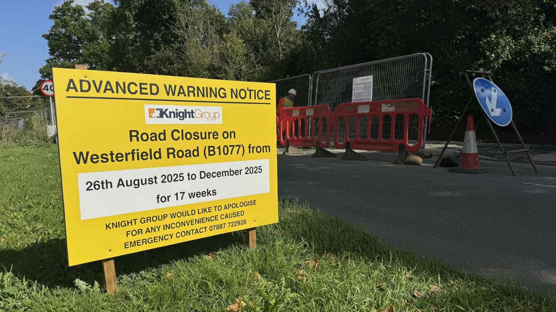 A bright yellow Advanced Warning Noticed sign. It warns motorists of an upcoming road closure in Westerfield Road.