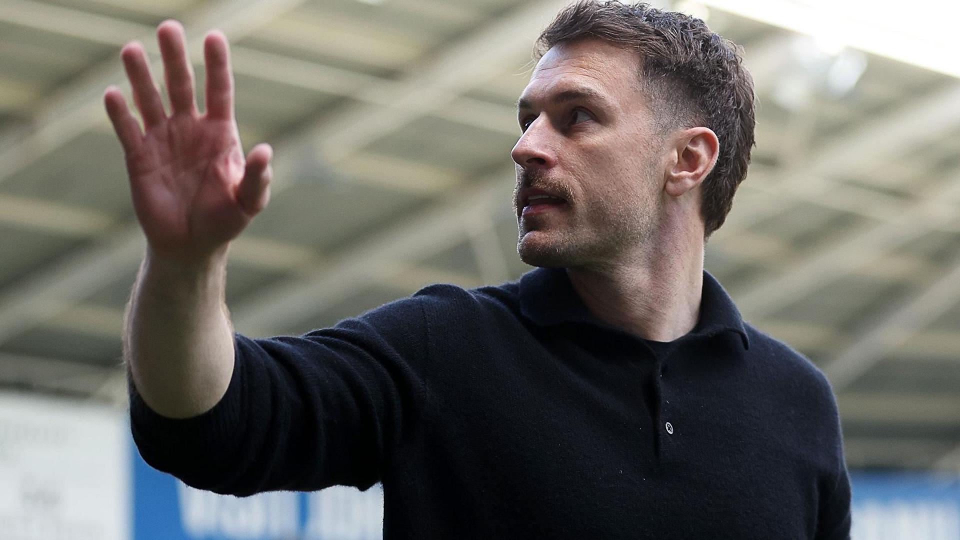 Aaron Ramsey gestures to Cardiff fans