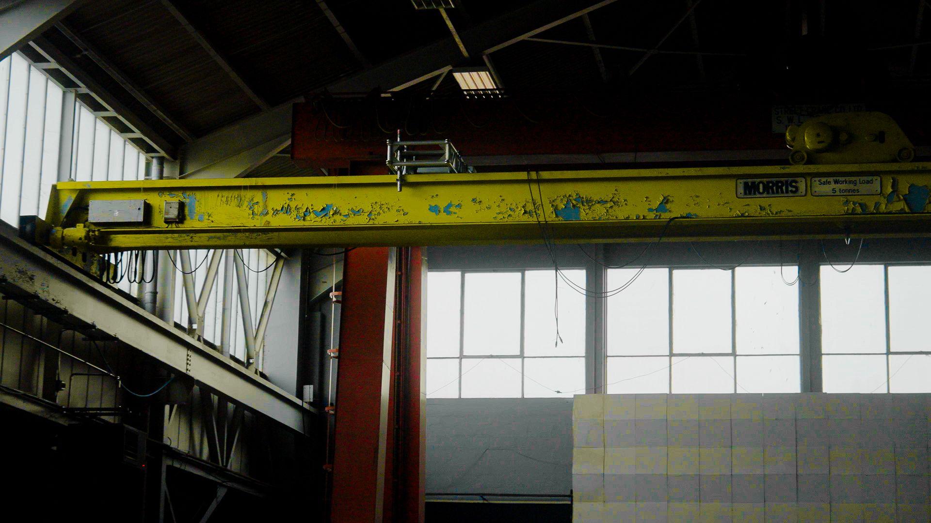 A yellow beam in the ceiling of a warehouse in Bristol