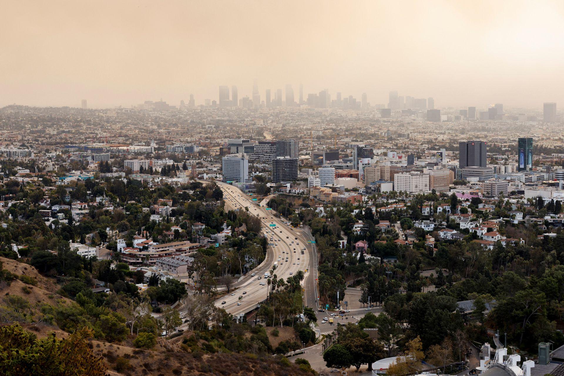 Heavy smoke fills the LA skyline as multiple fires rage in Los Angeles on Wednesday.