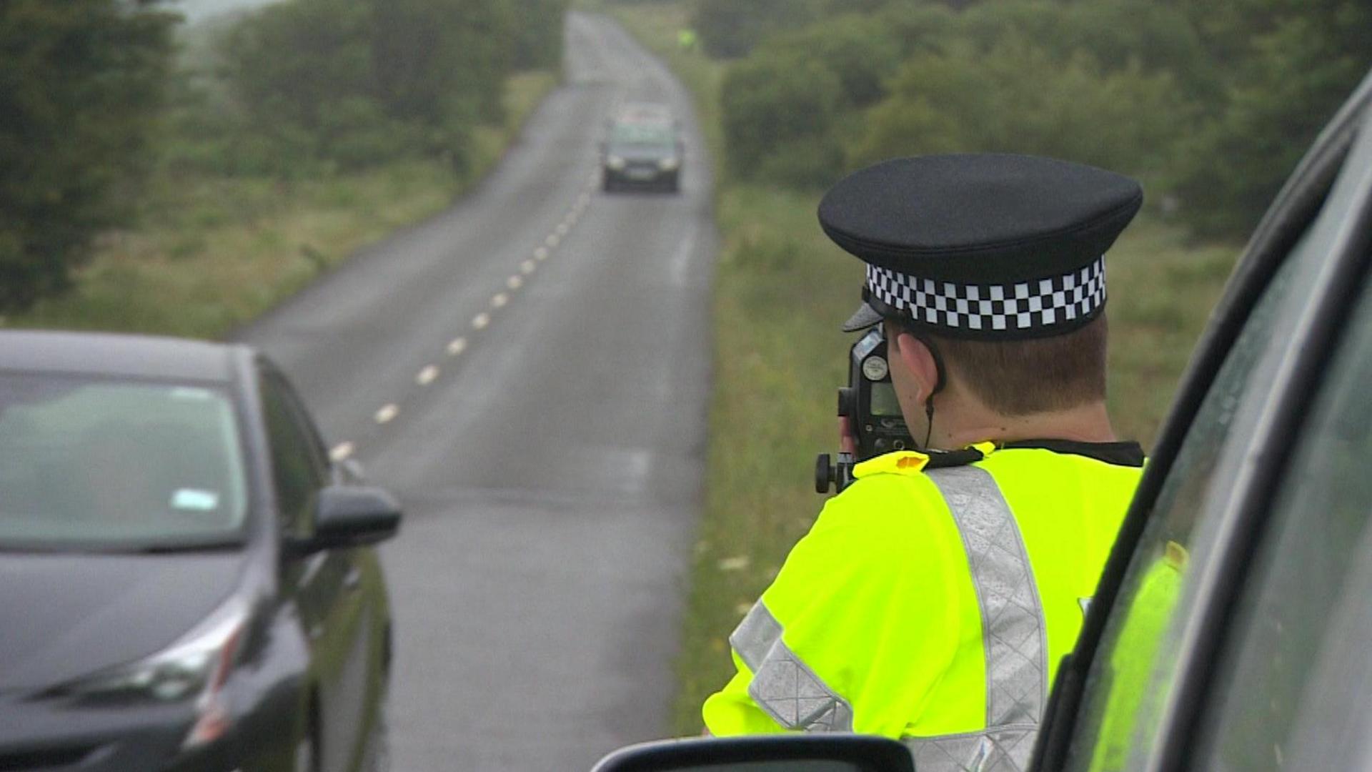 Police officer with speed gun