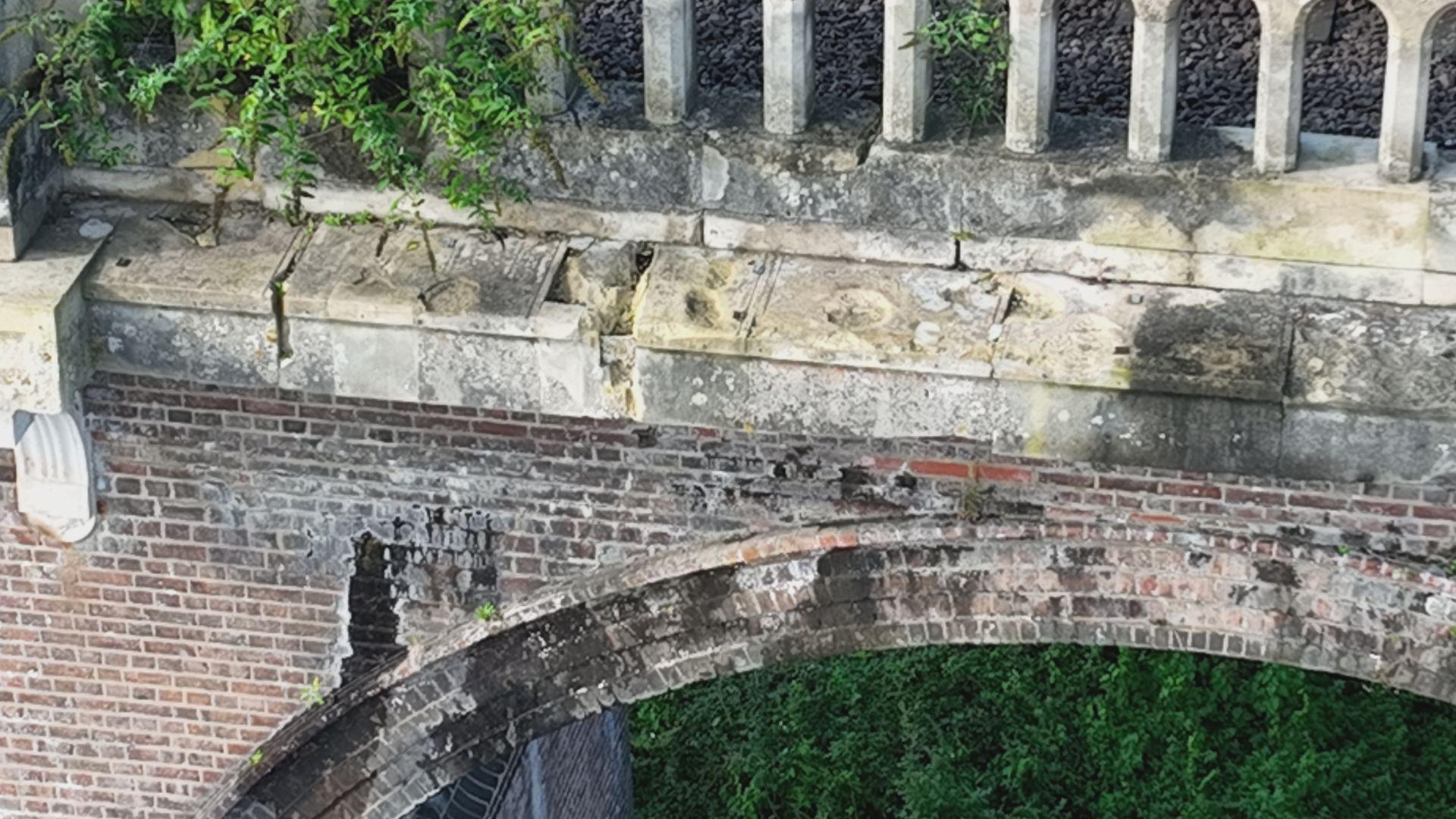 Chipped stonework on top of a viaduct bridge