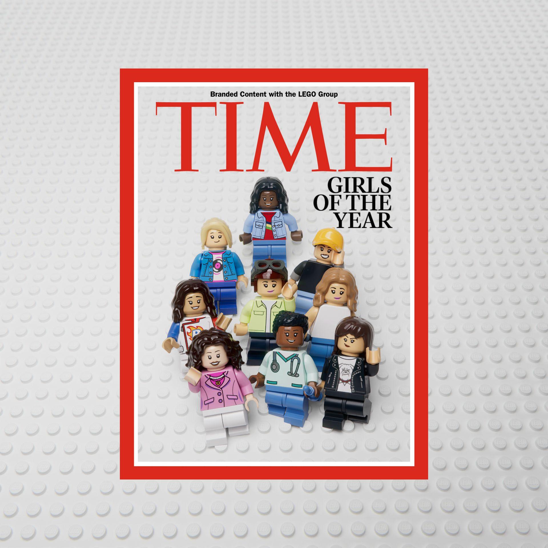 A magazine mock-up, with a headline saying Girls of the Year, and nine Lego mini figures posed as the cover's image 