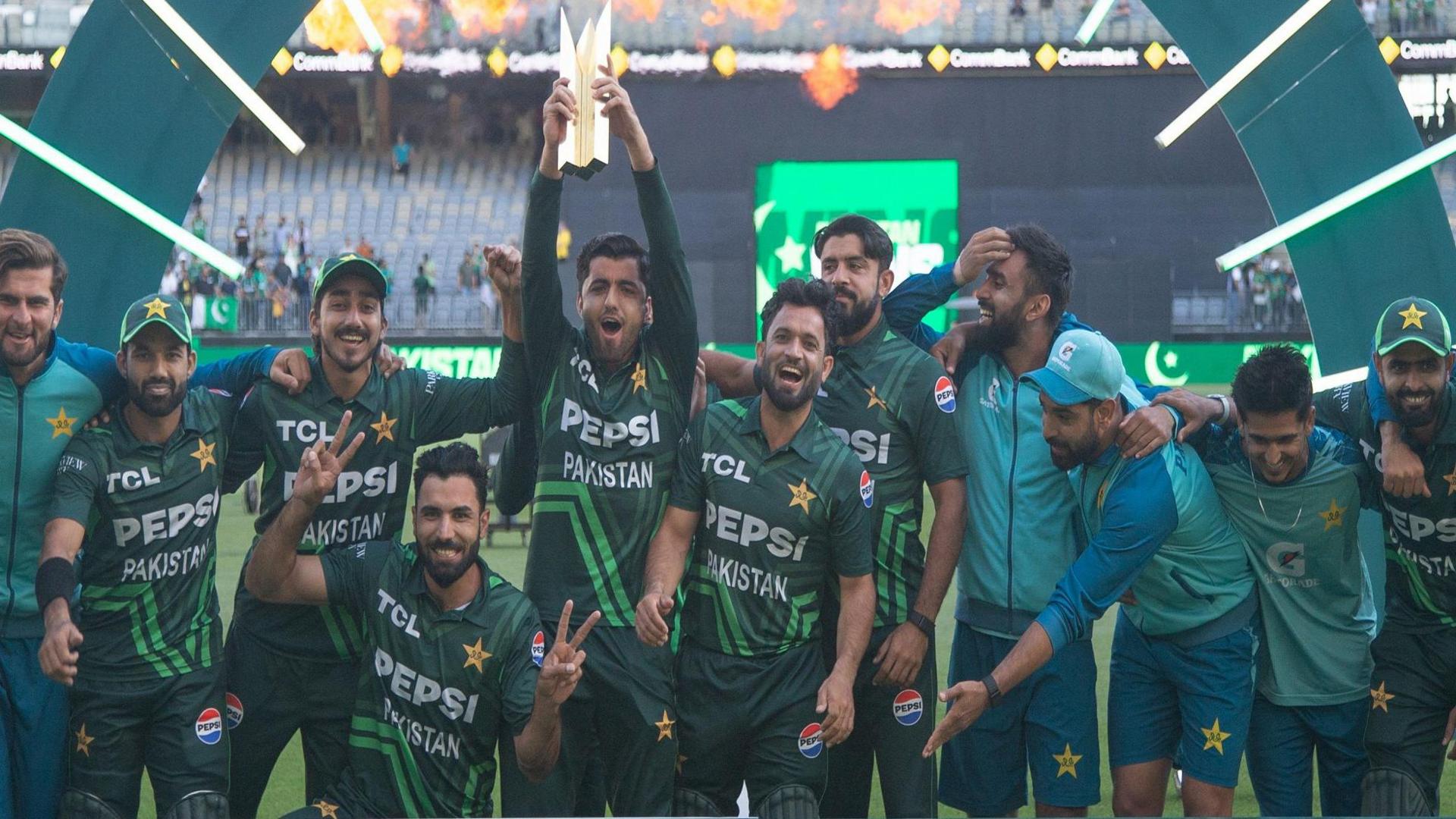 Pakistan players celebrate with the series trophy