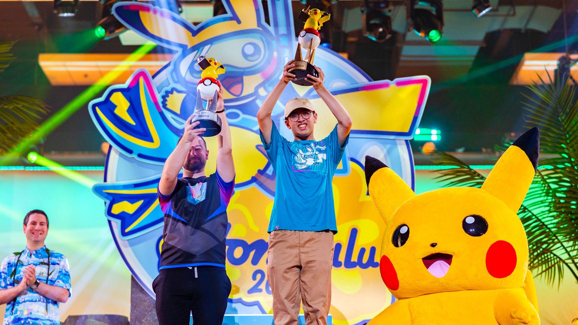 Top finishers from the Pokémon World Championships with trophies. 