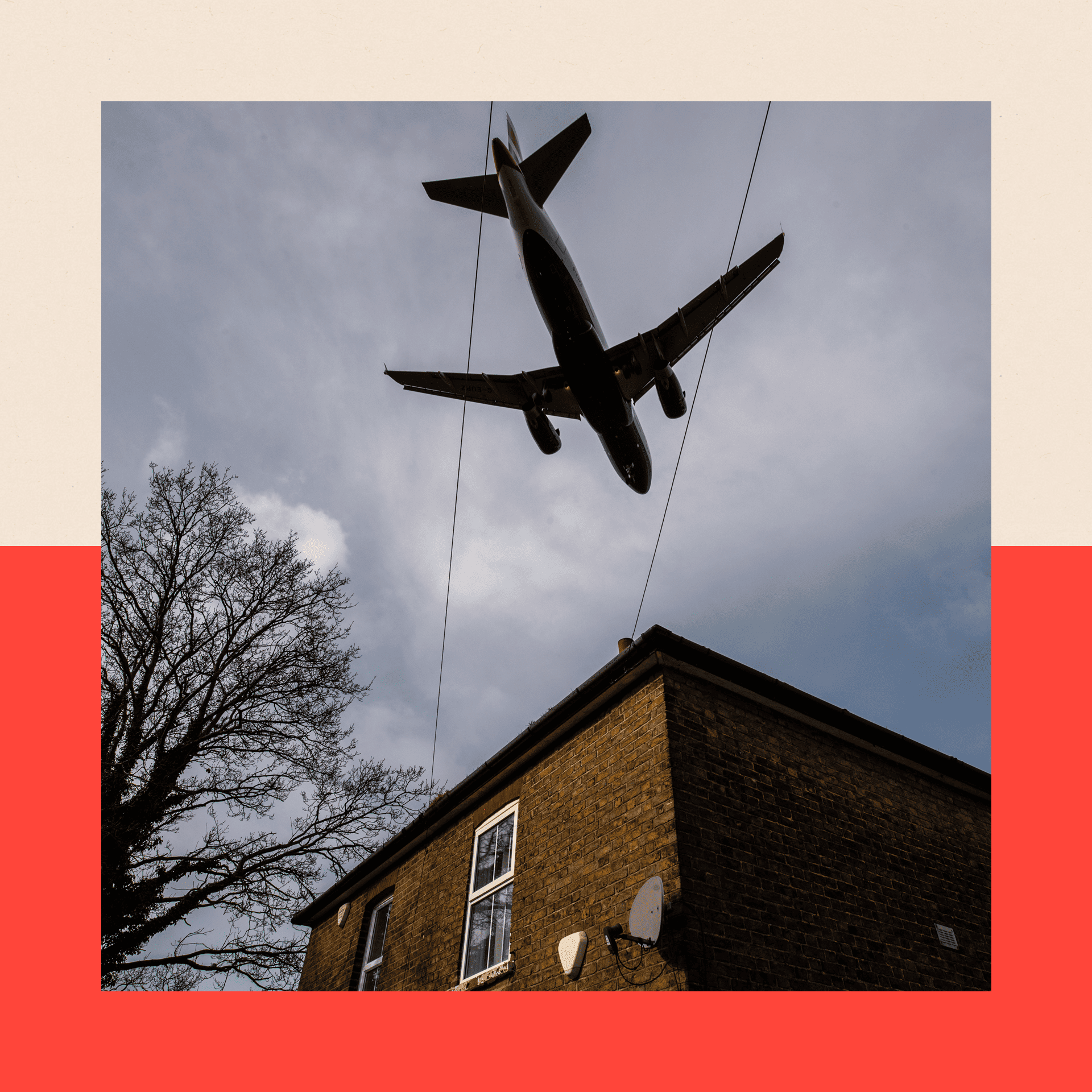 Aircraft comes in to land at Heathrow airport over nearby houses