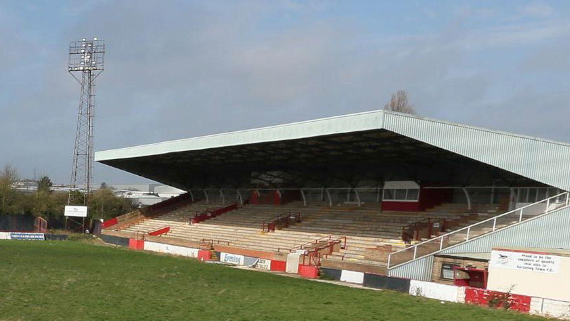 A derelict Rockingham Road as seen in 2013. The pitch has become visibly overgrown and the stadium appears in a poor general state of repair.