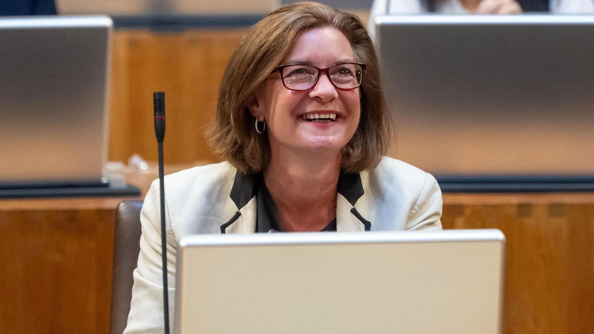 A smiling Eluned Morgan in the Senedd chamber