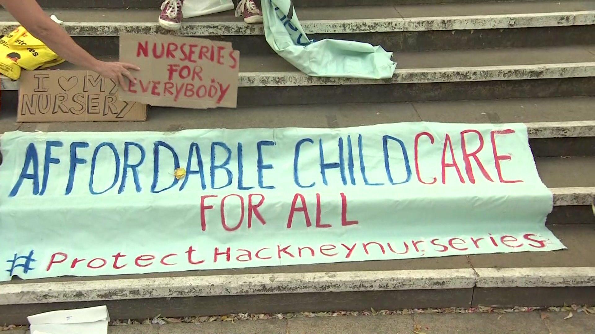 A banner saying "affordable childcare for all" at the protest outside Hackney council