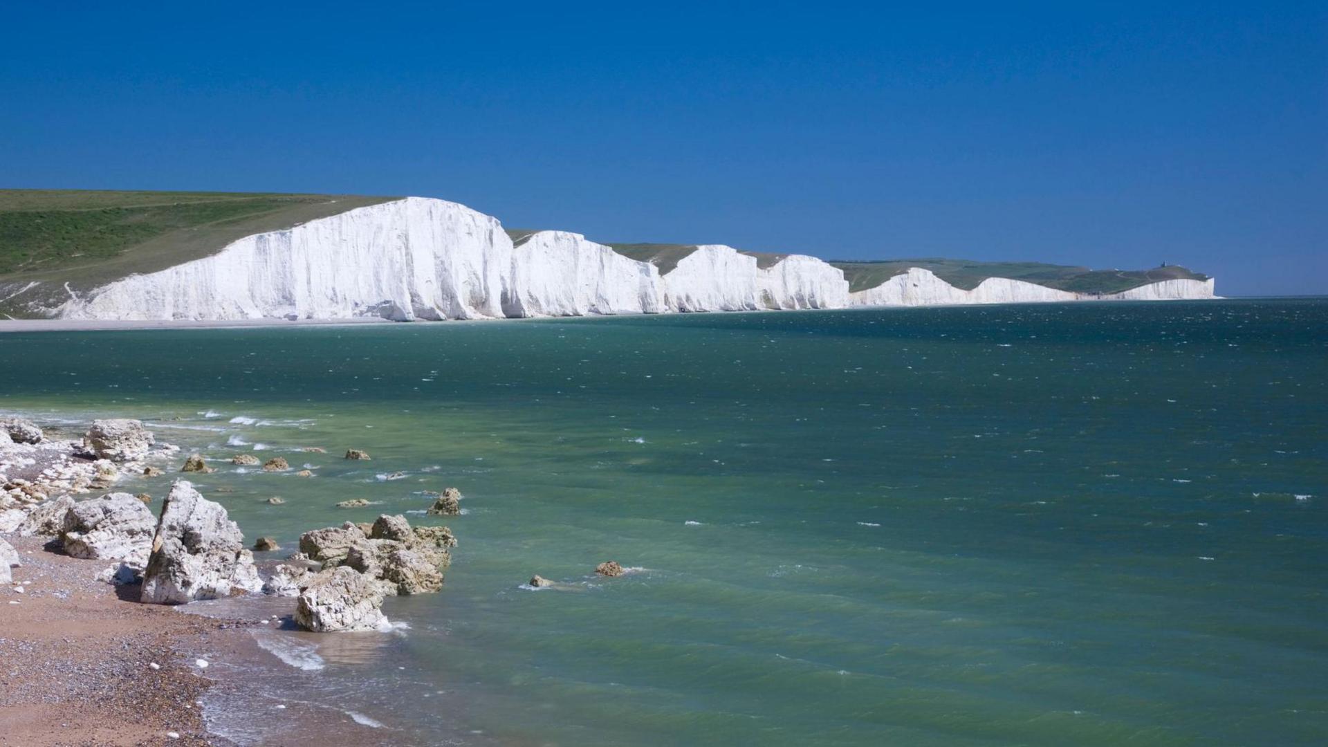 The Seven Sisters cliffs - which are white chalk - as seen from the sea.