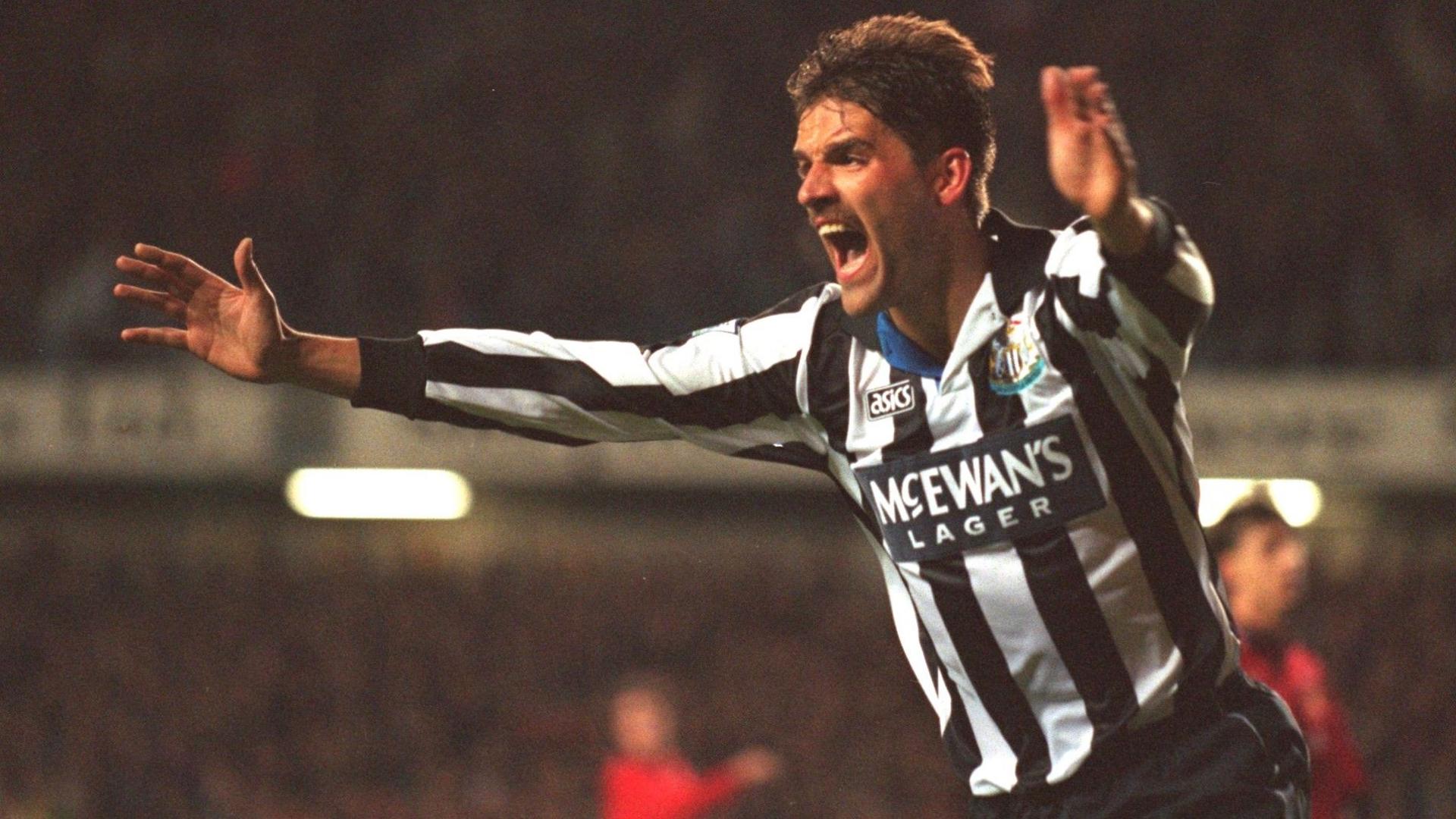 Philippe Albert celebrates with arms outstretched after scoring for Newcastle against Manchester United