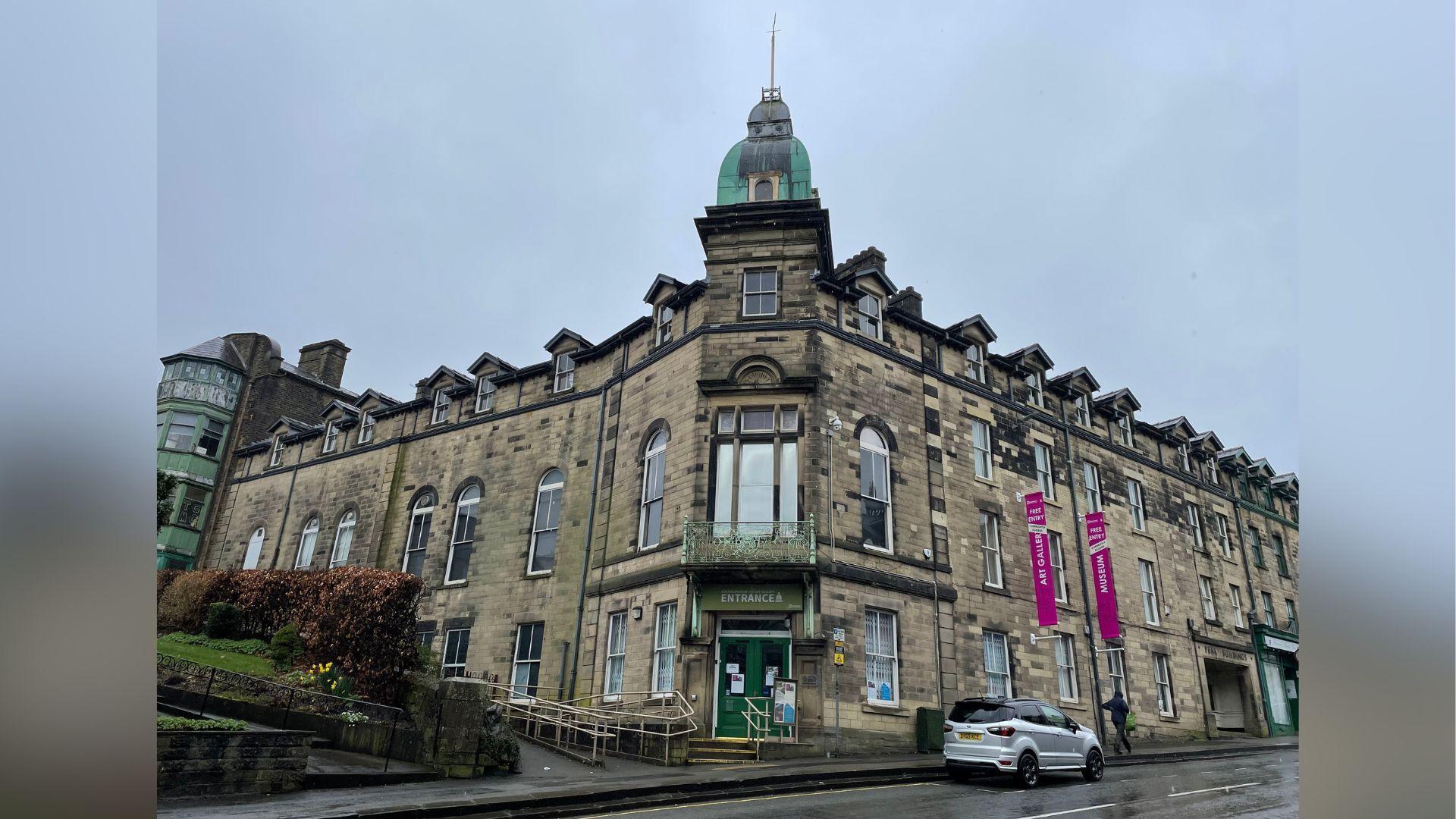 An exterior view of the three-storey building