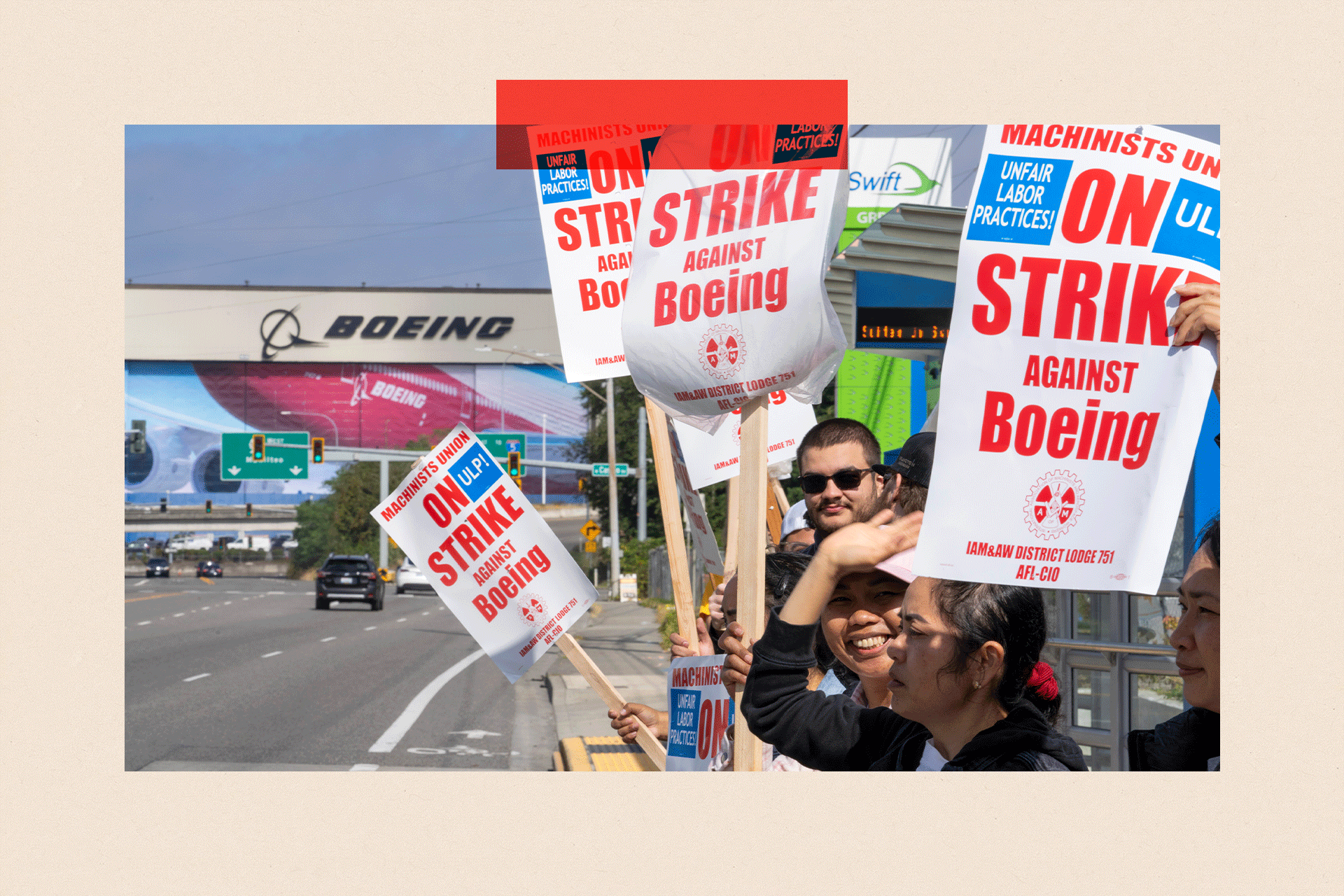 Boeing workers picket outside a Boeing facility during a strike