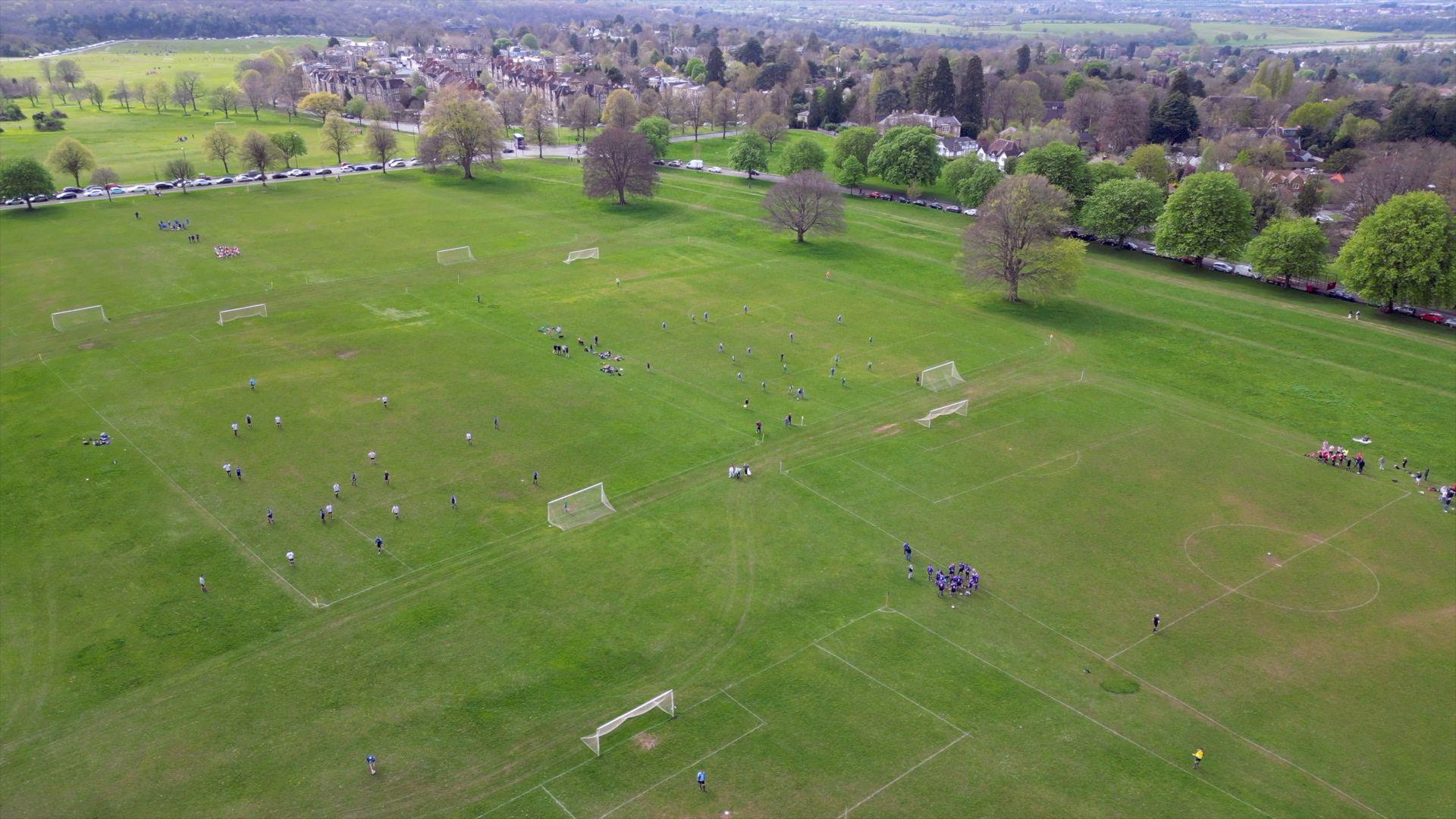 Aerial view of football matches taking place at Clifton Downs, Bristol