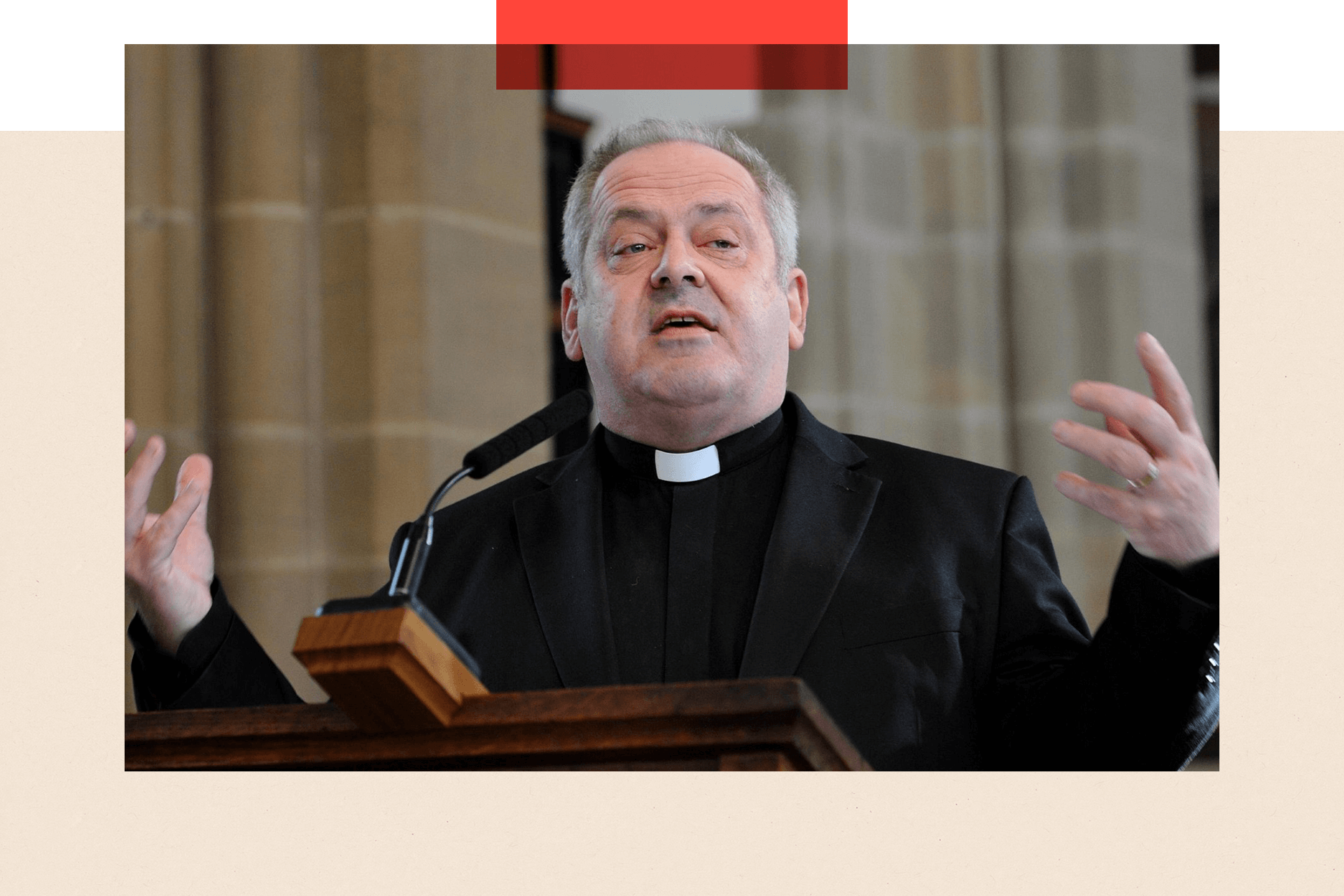 Andrew Hindley speaks from a pulpit