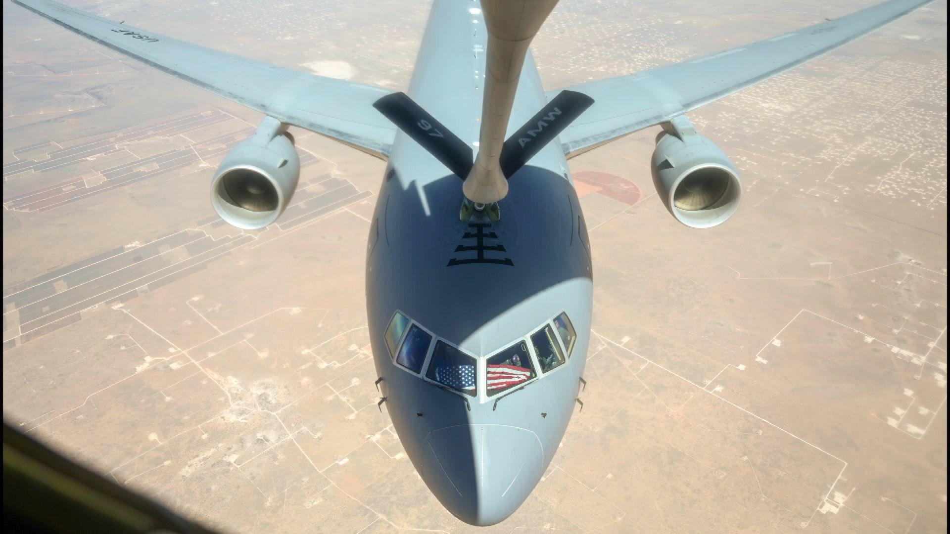 A US Air Force KC46 Pegasus aircraft, like that flown by the American visitors prepares to take on fuel in flight from another tanker plane.