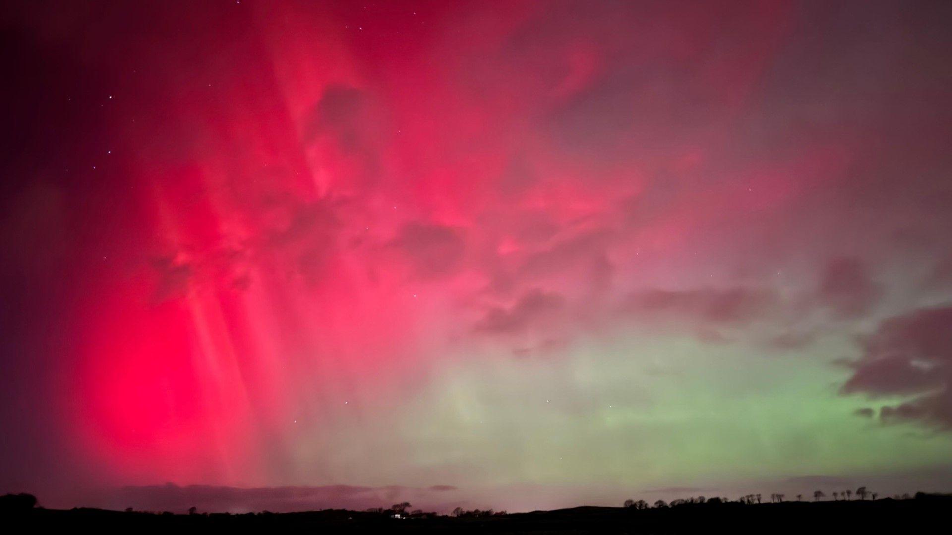 Red and green light up the sky above Downpatrick in Newry Mourne And Down