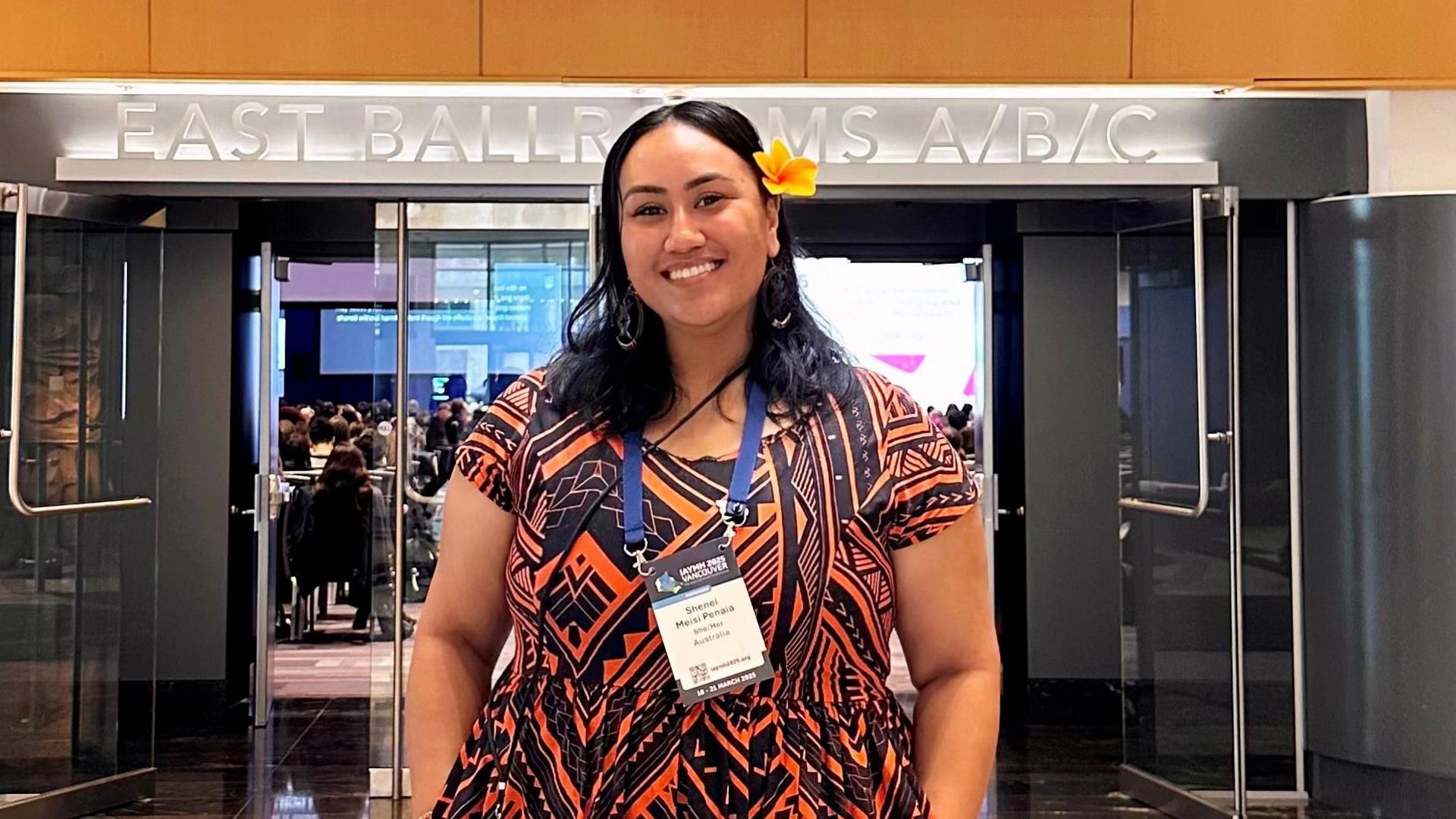 Mental health worker Shenei Penaia, smiling at camera