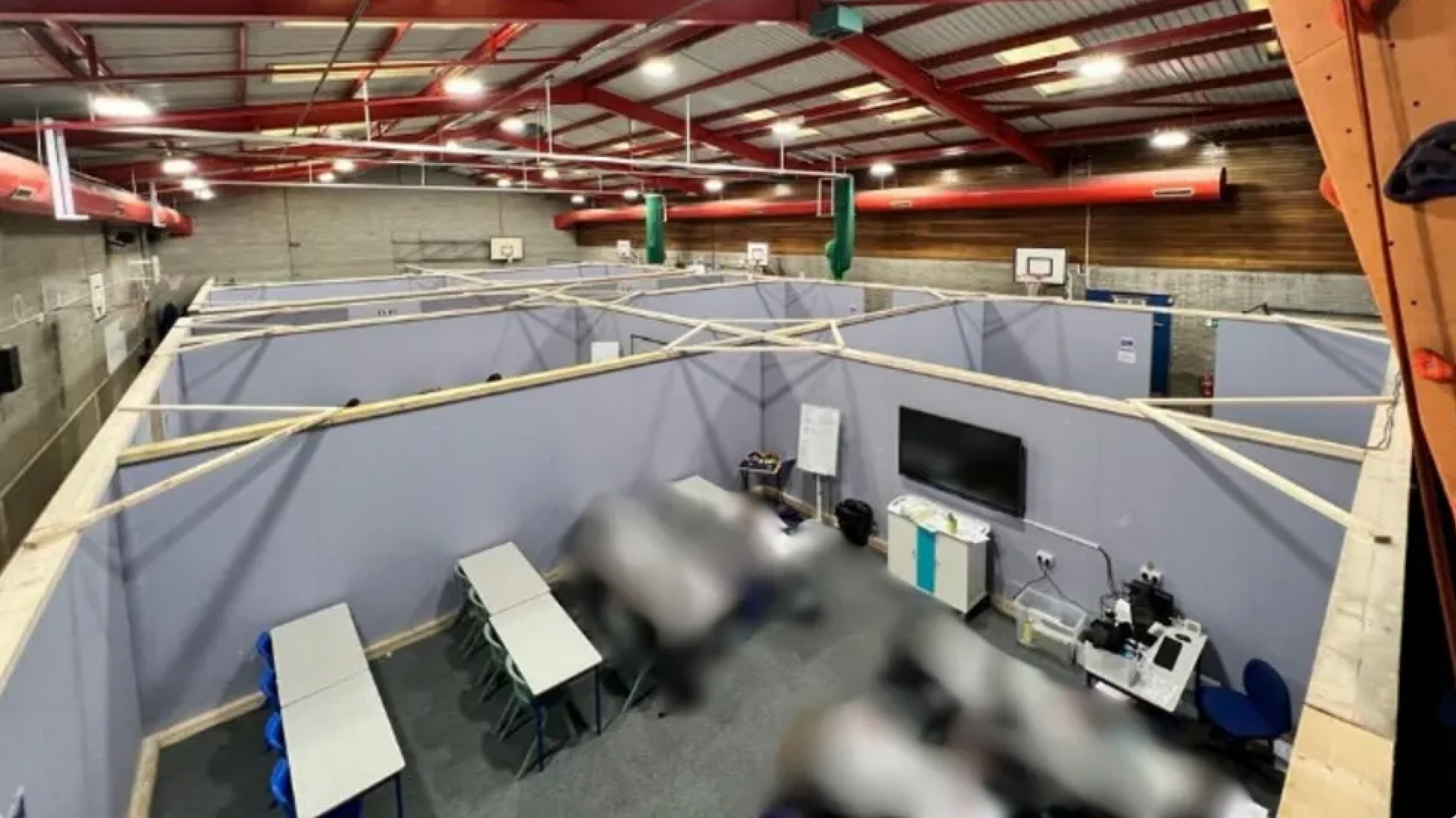 The sports hall at St Leonard's Catholic High School divided into eight makeshift classrooms.