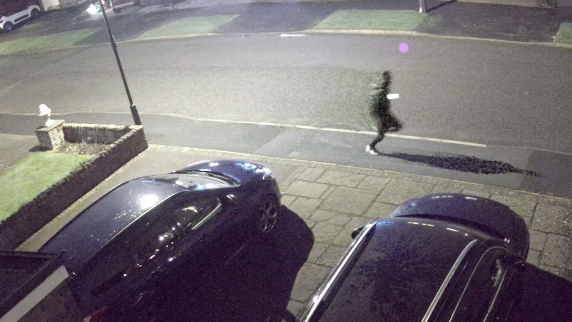 Man leaving the scene after a stabbing. He is pictured in the distance on a CCTV images.