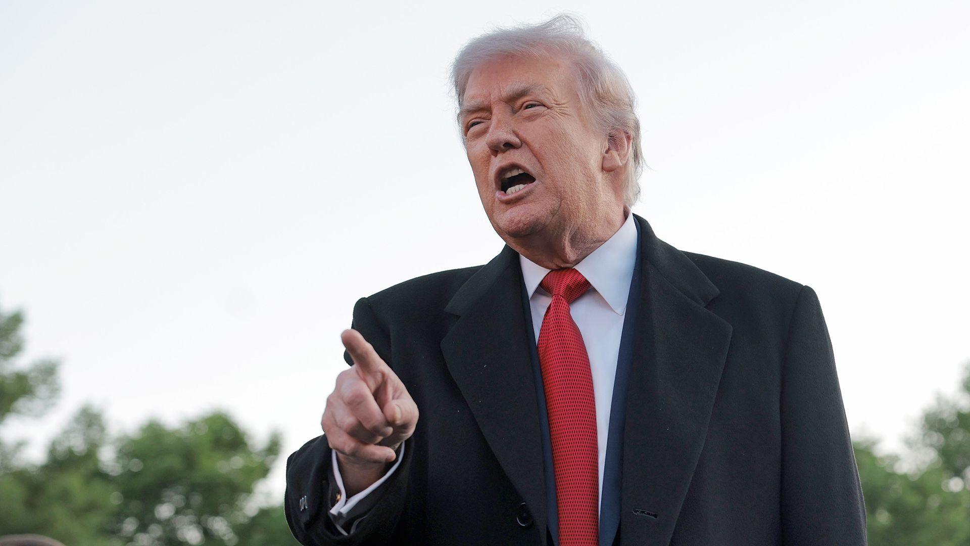 US President Donald Trump speaks to reporters Lincoln Memorial Reflecting Pool in Washington DC.
