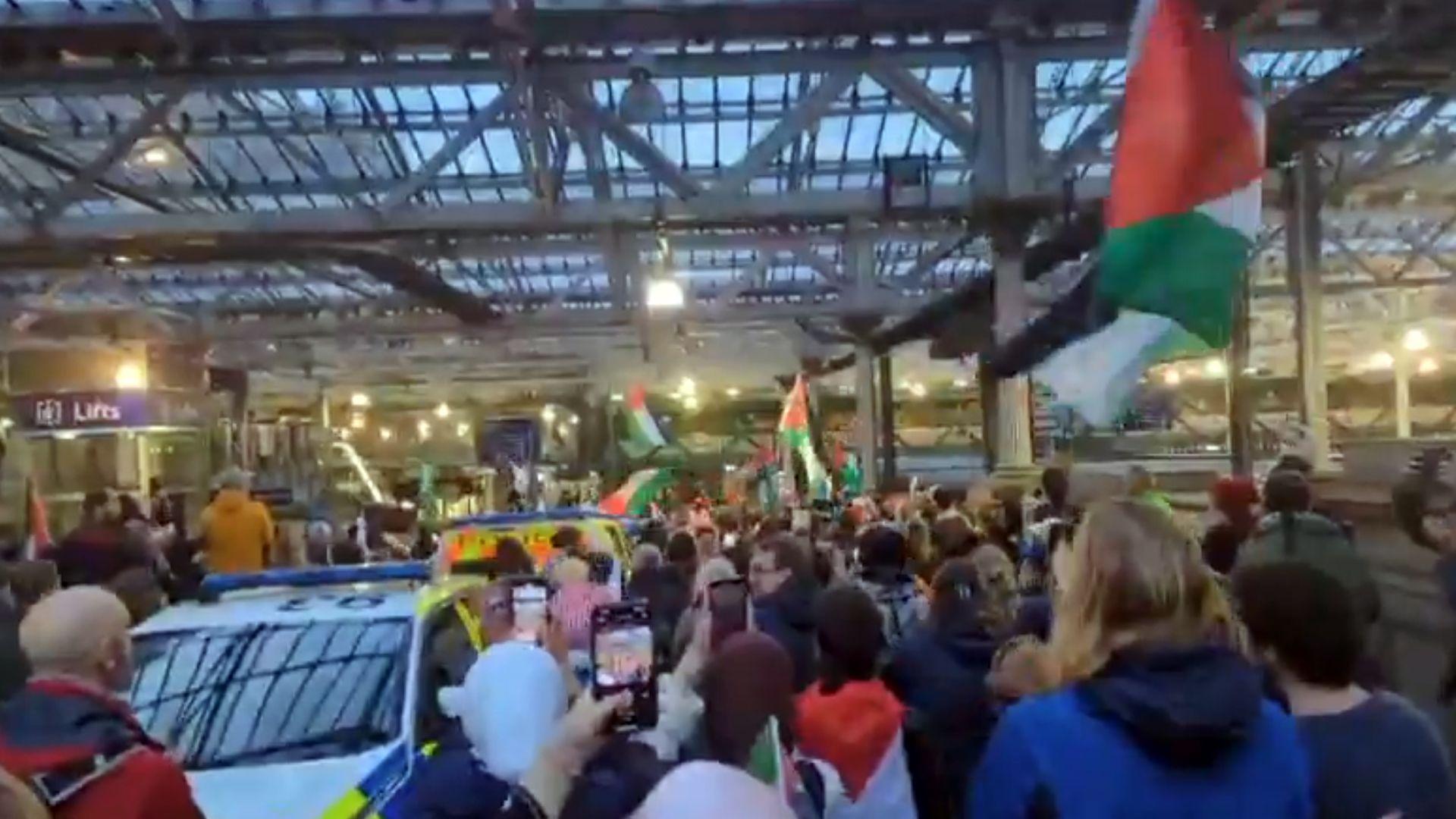 Crowd with flags and phones