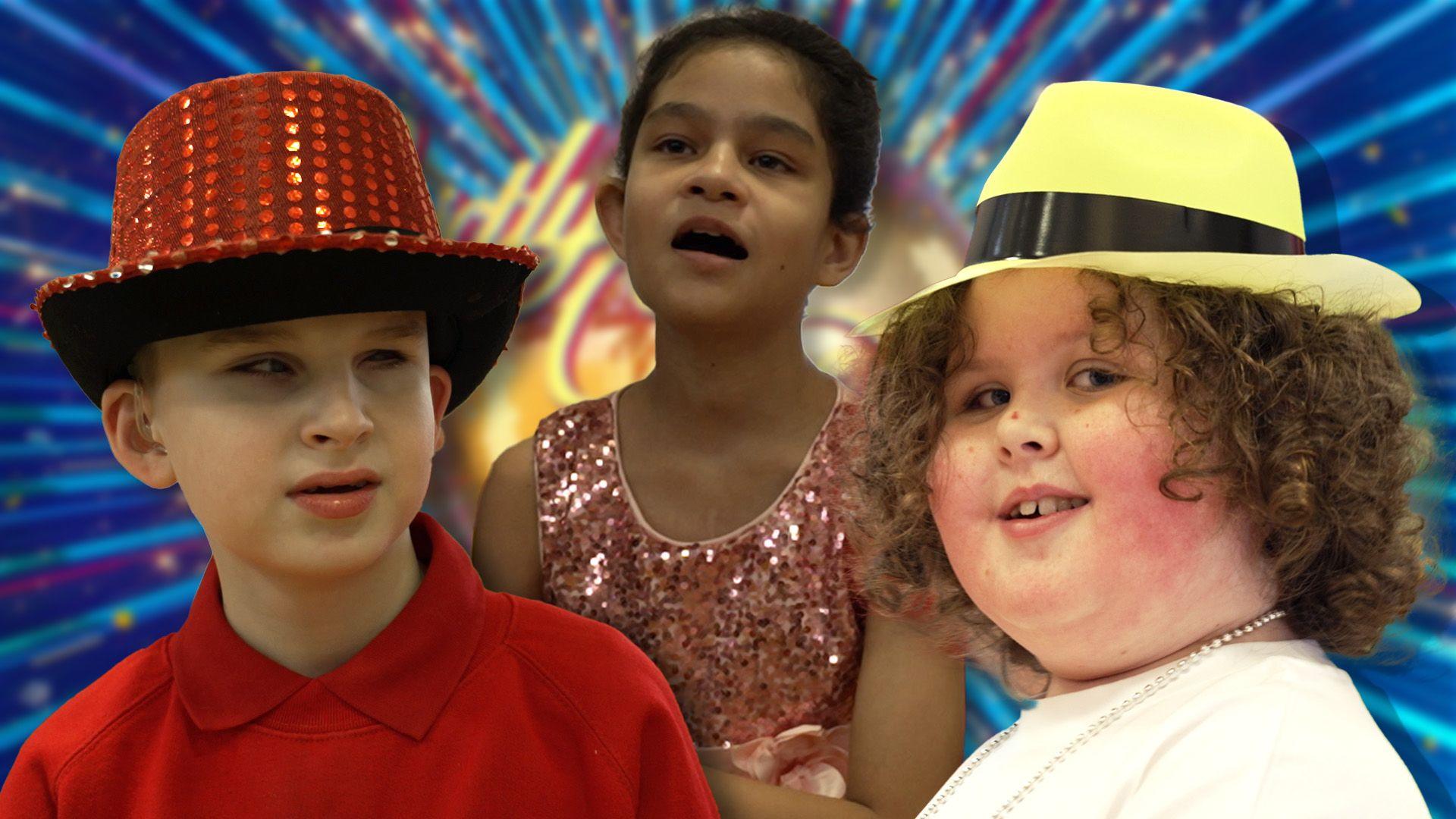 Three children dressed in hats and sparkles in front of Strictly branding