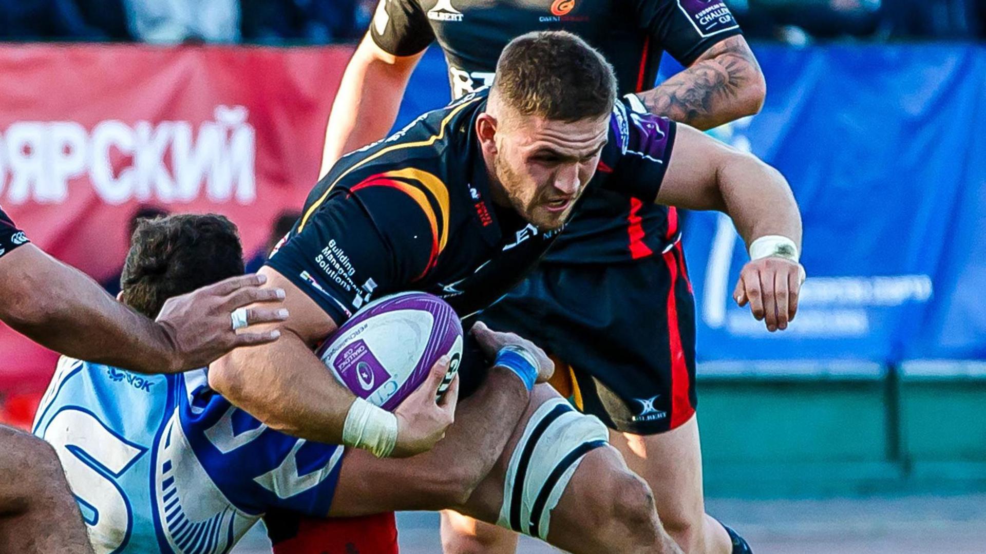 Harri Keddie carrying the ball for Dragons at Enisei-STM