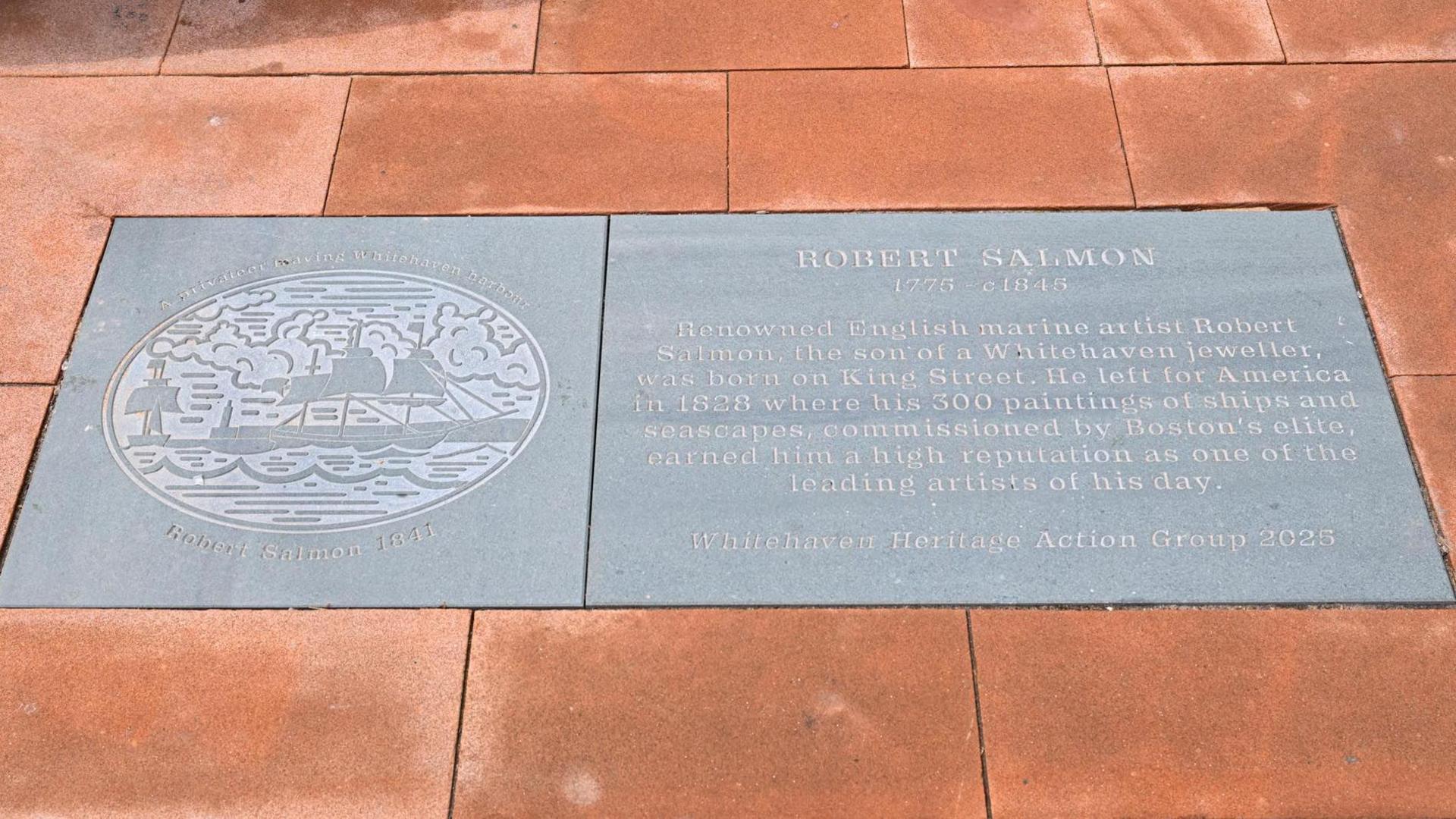 The memorial flagstone to Robert Salmon made of slate and etched with image of a ship and some words remembering who he was.