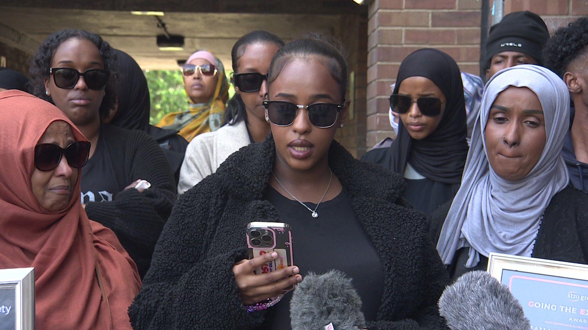 A group of Somali women give a tearful statement to the media