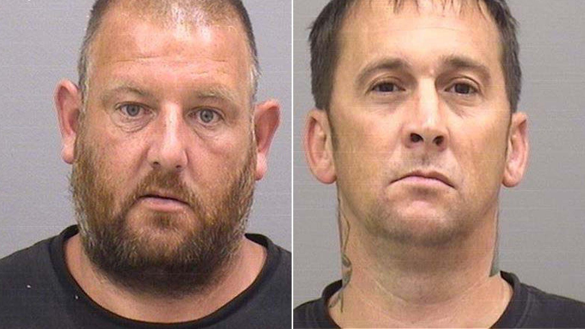 Ian Vetier, on the left of the image, is a middle aged man looks at the camera for his custody picture, he has a short full beard which is a mixture of grey, brown and red with very short shaved hair and wears a dark grey top. Kevin Searle, on the right of the image, is clean shaven with short light brown hair, he is looking at the camera, wearing a dark grey top and a tattoo can be seen wrapped around the back of his neck