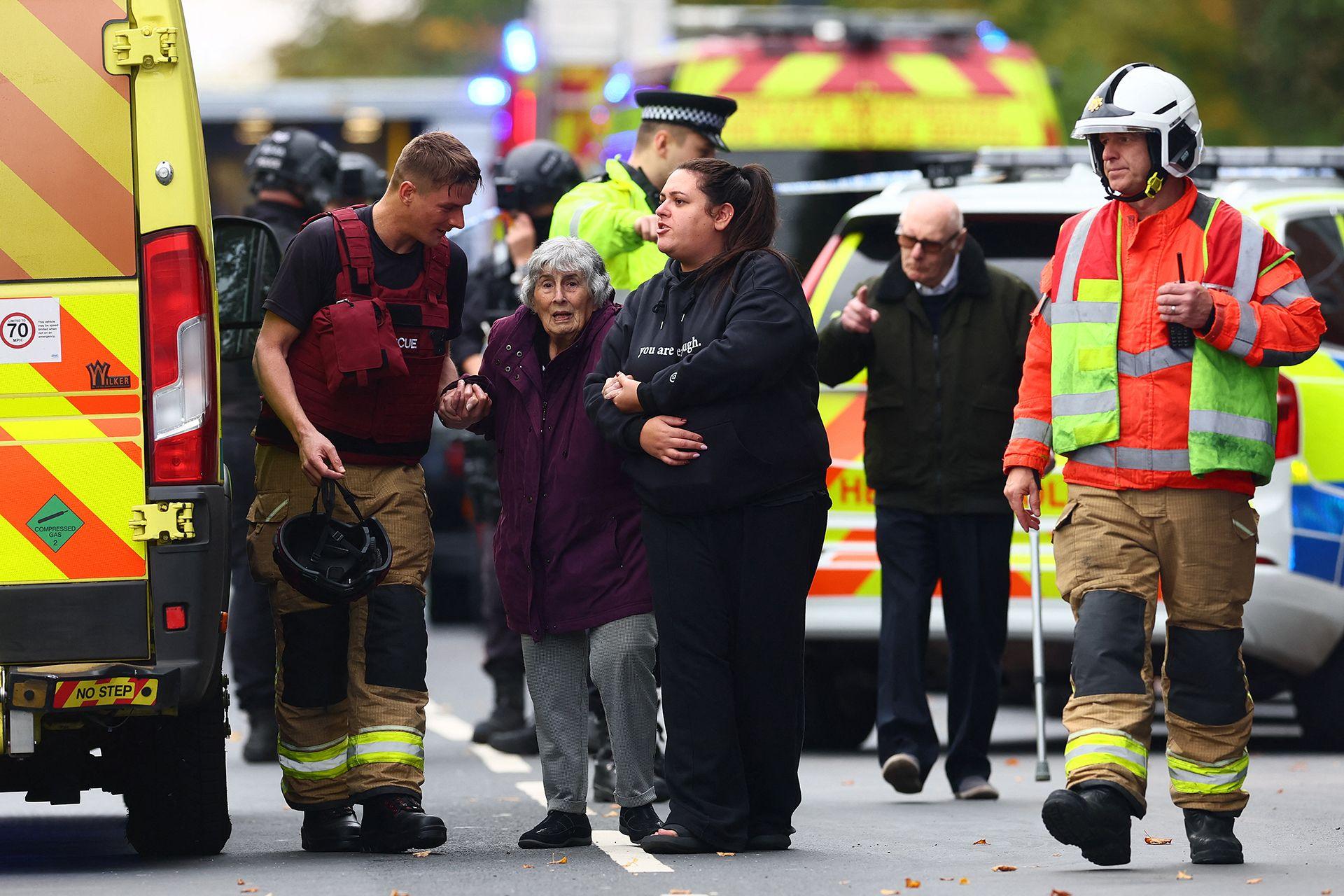 Members of the emergency services evacuate members of the community near Heaton Park Hebrew Congregation synagogue in Crumpsall, north Manchester, on October 2, 2025, following a "major incident" at the synagogue.
