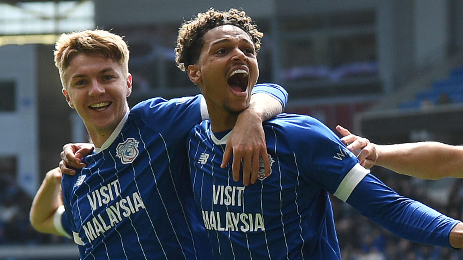 Omari Kellyman (right) celebrates scoring for Cardiff with Joel Bagan