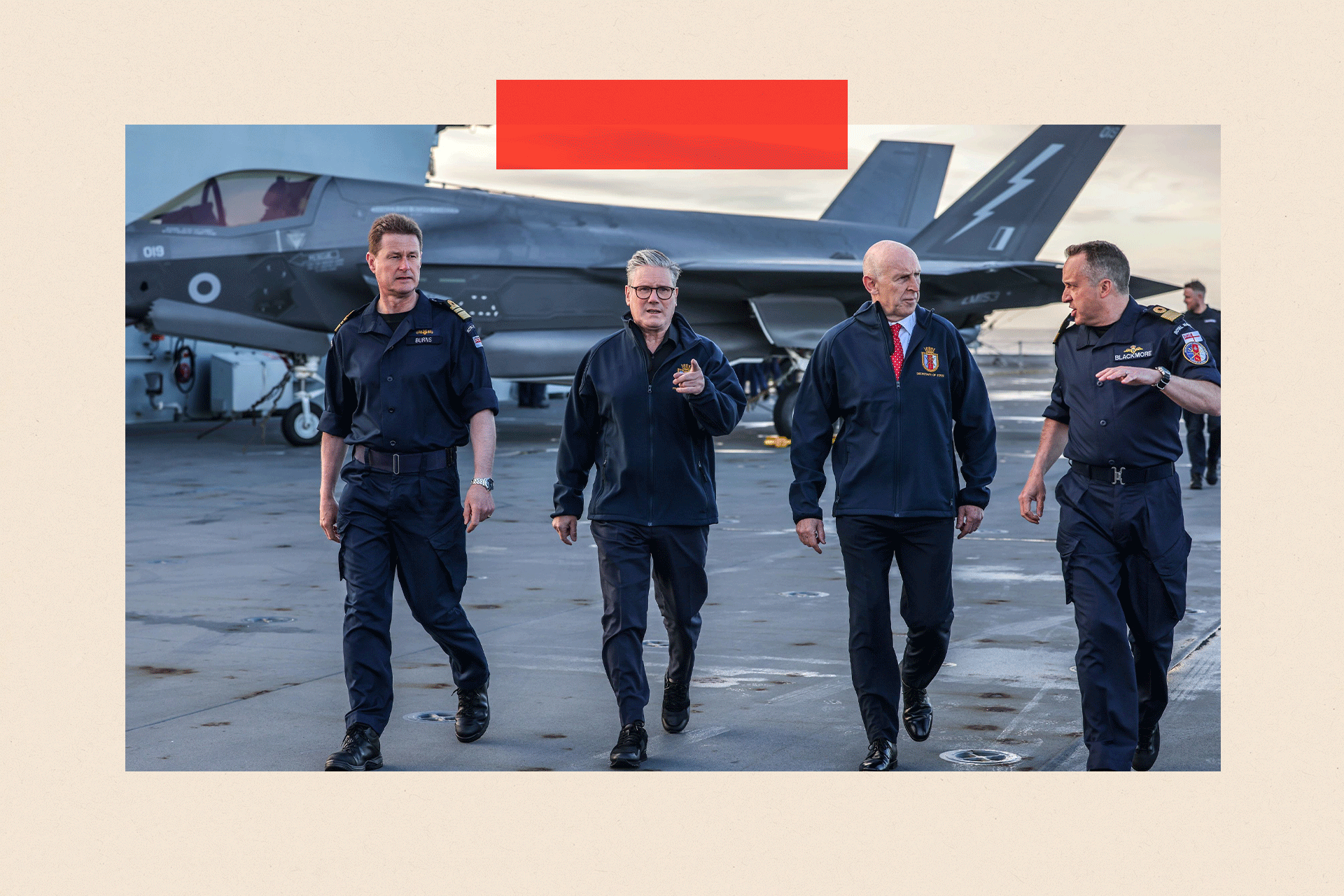 Prime Minister Keir Starmer (second left) and Defence Secretary John Healy (second right) talk with naval officers