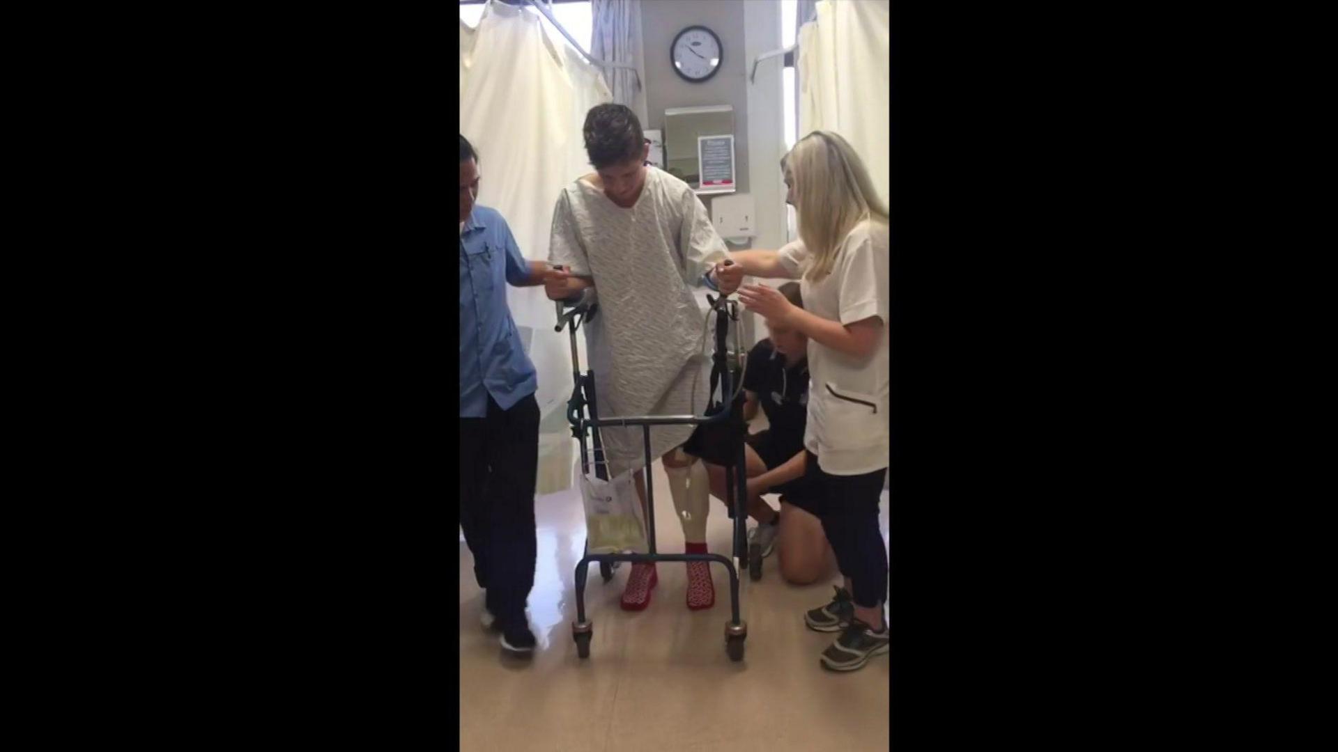 Ed Caudwell at the hospital after his accident being assisted by staff on a walker.