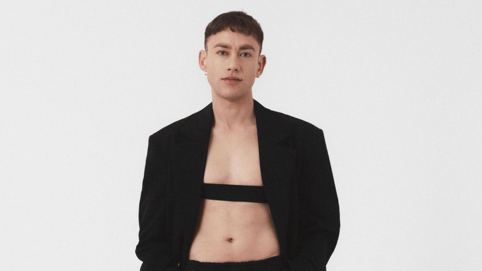 Olly Alexander wearing a black blazer