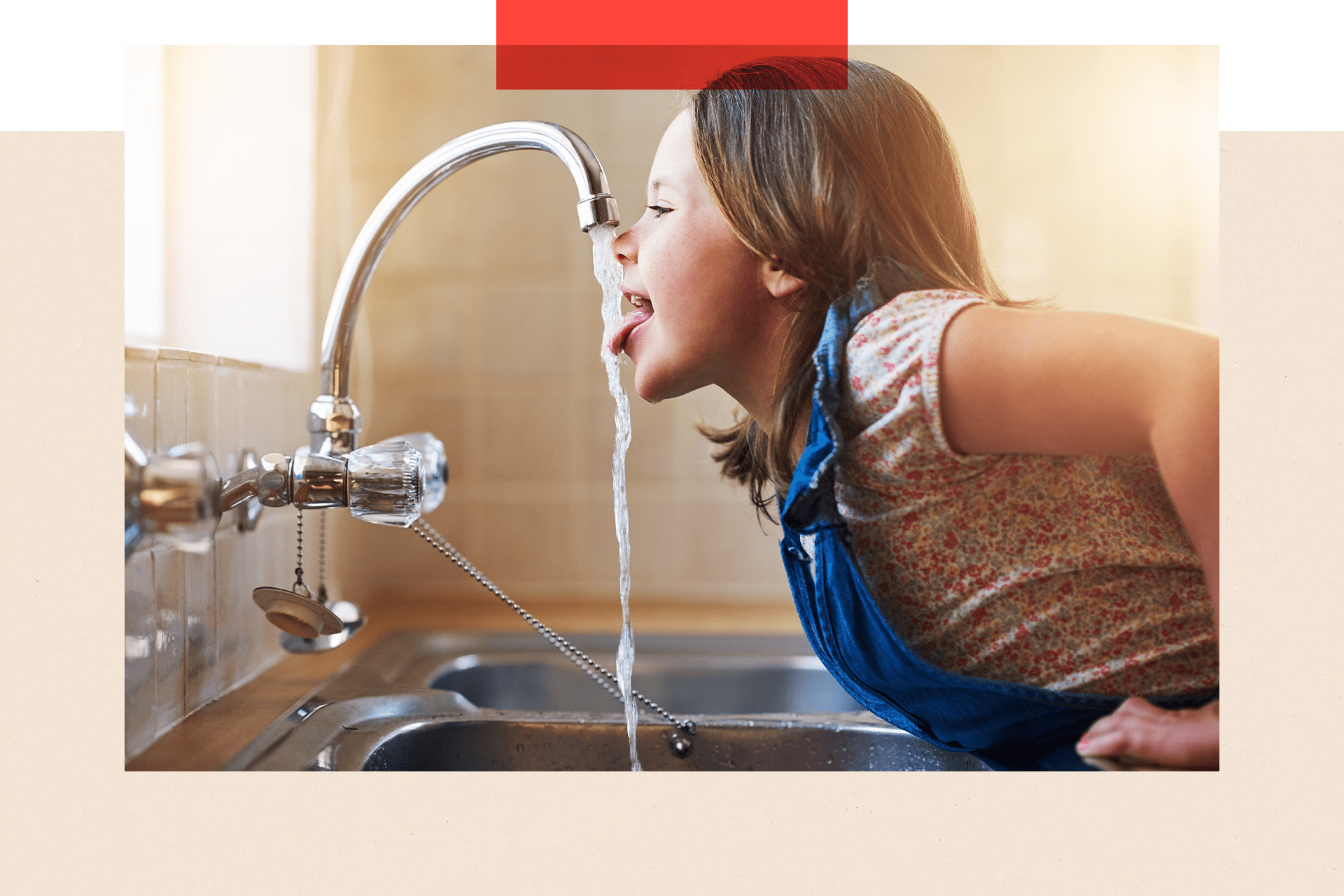 A photo of a girl drinking water from a running tap