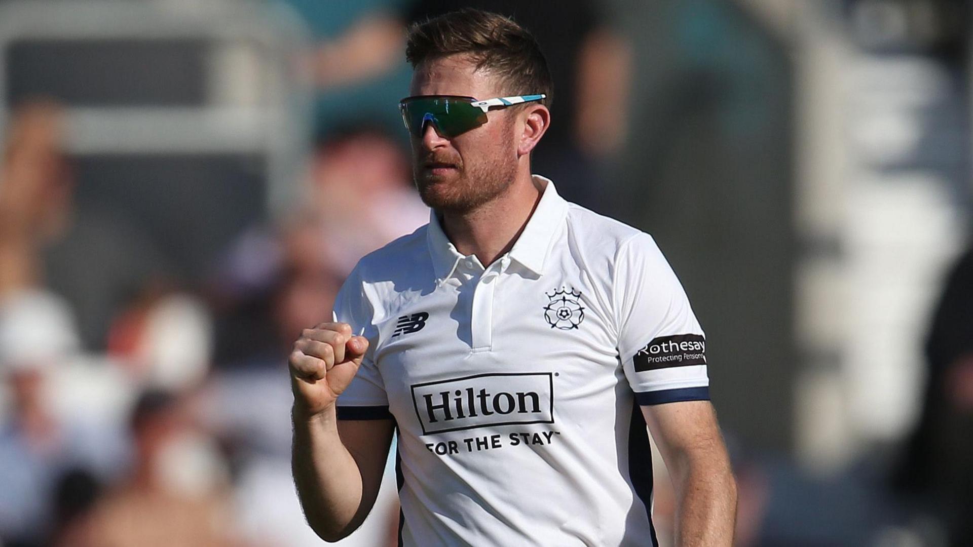 Hampshire bowler Liam Dawson pumps his fist after taking a wicket 