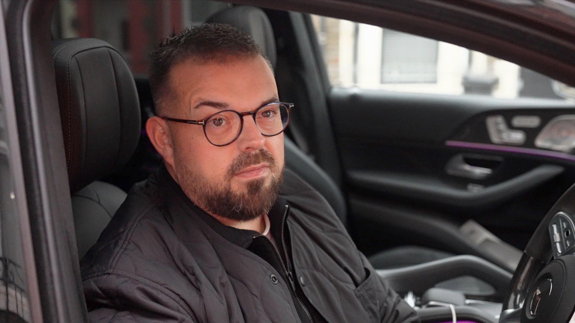 Nic Collins sat in his vehicle