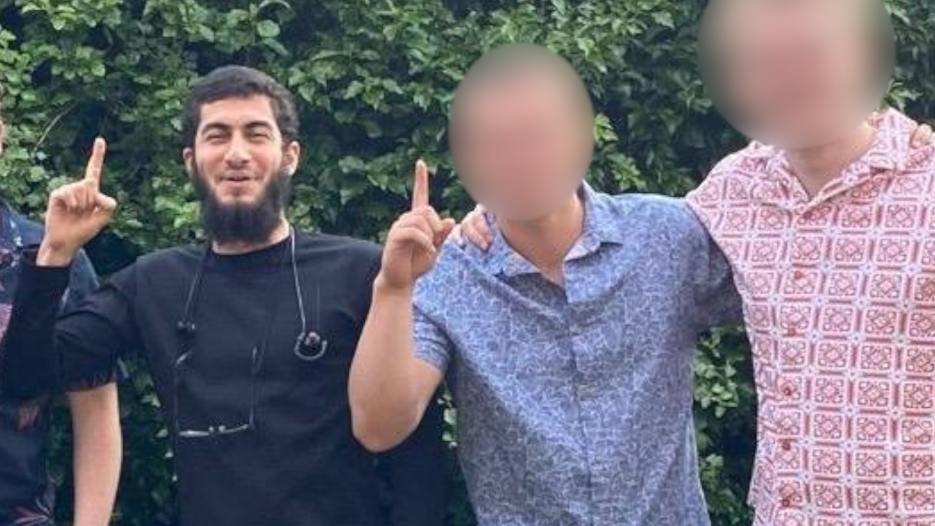 Mohammed Farraj pictured with two other men, whose faces are blurred.