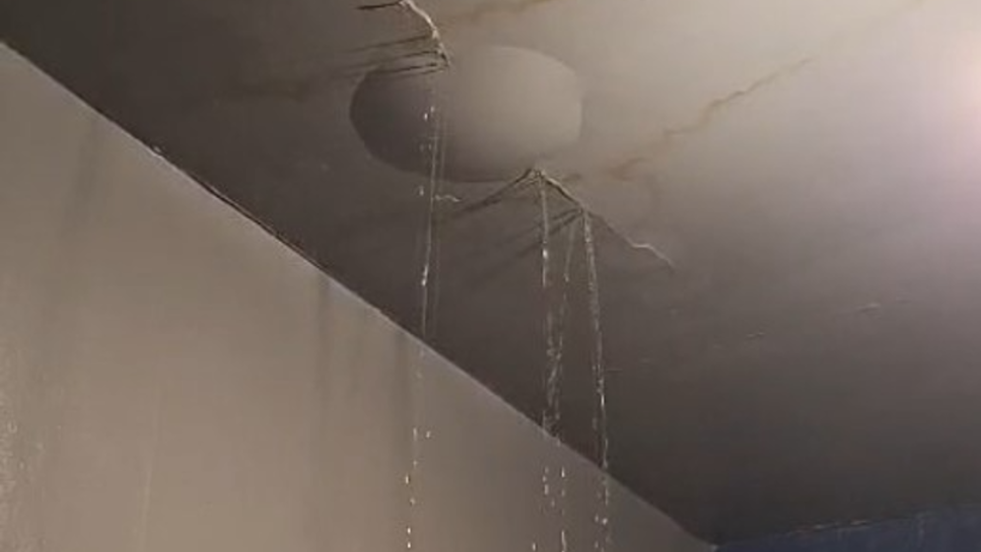 Water leaking through a ceiling