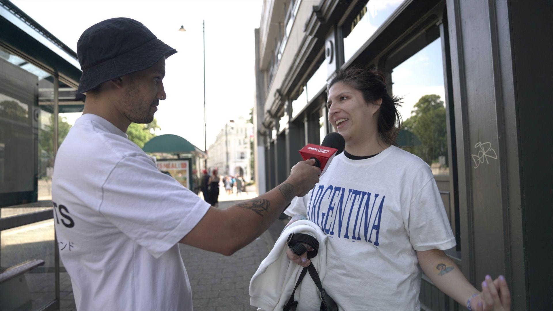 Reporter interviewing Oasis fan